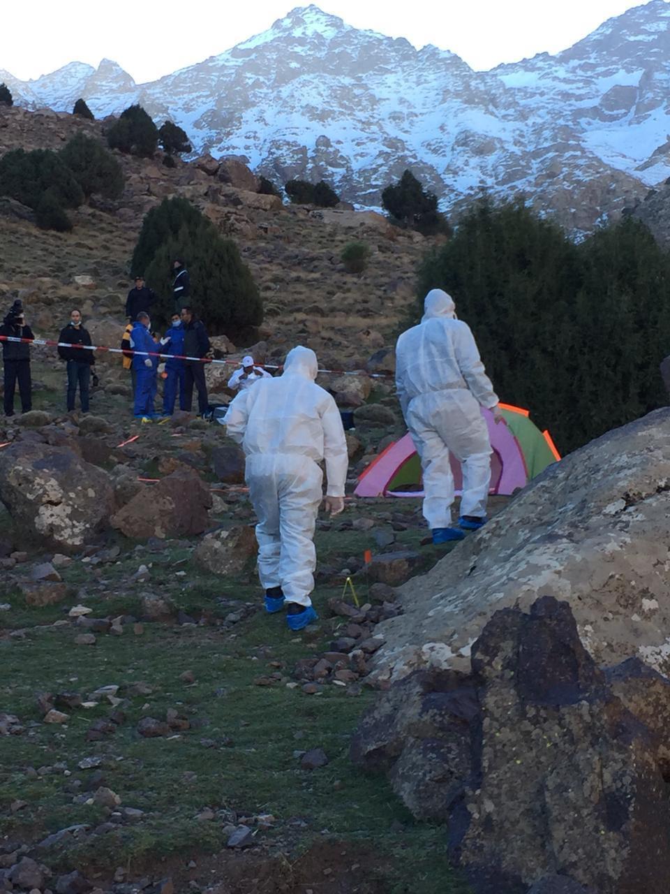 A forensic team in the area where the bodies of two Scandinavian women tourists were found near Imlil in the Atlas Mountains, Morocco