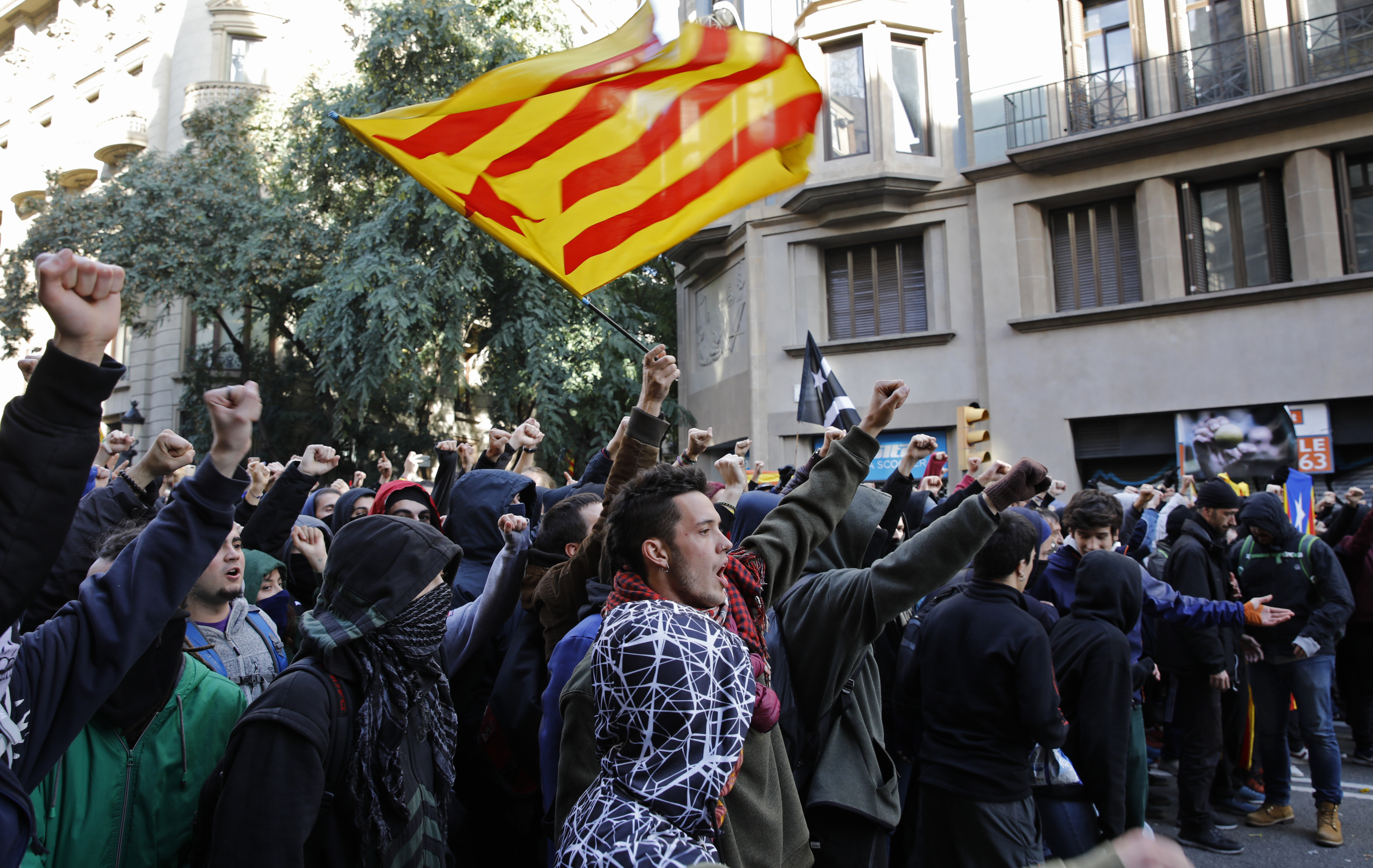 Pro-independence demonstrators march against Spain's cabinet holding a meeting in Barcelona