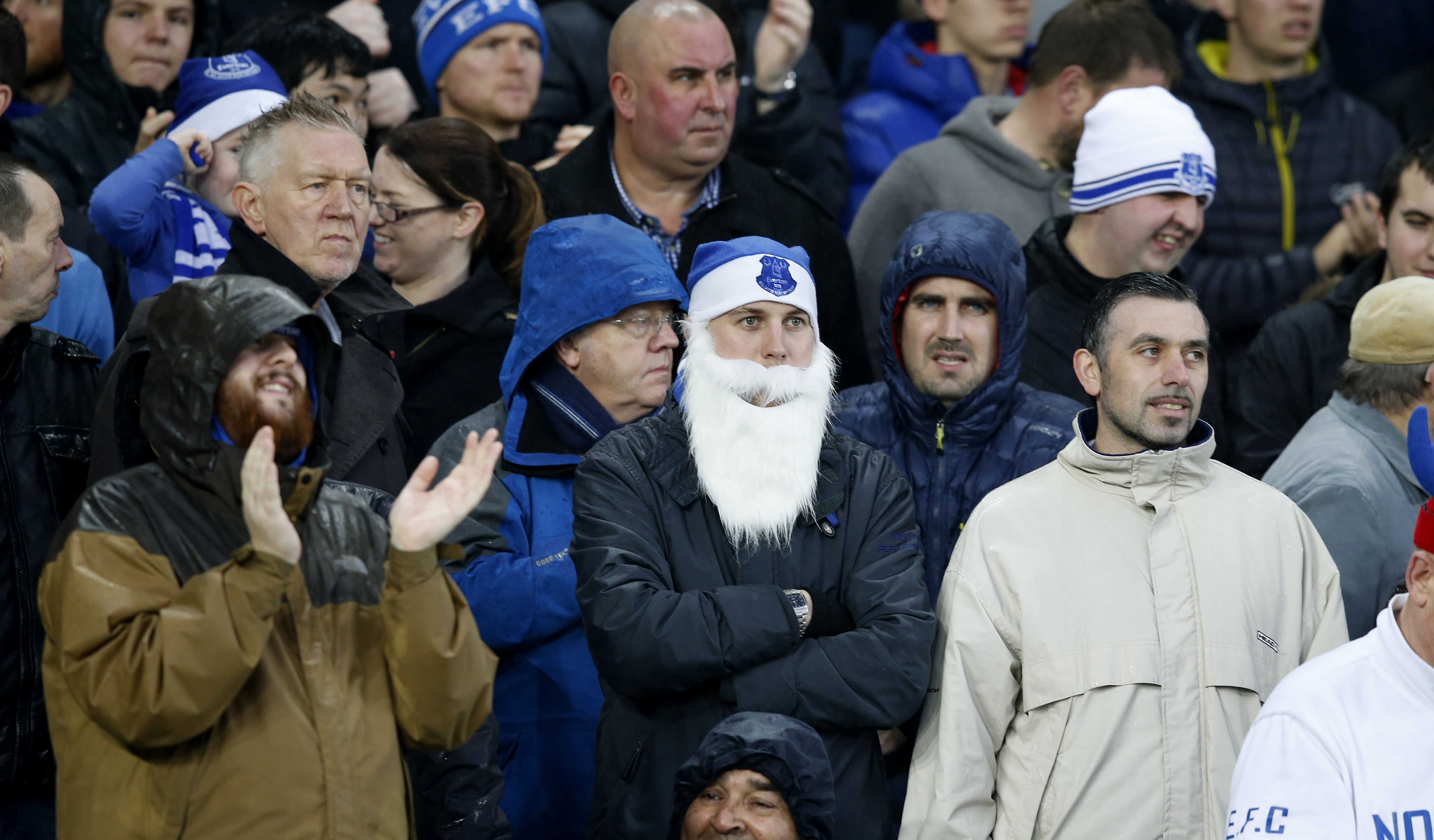 A fan dressed as Santa at a football match