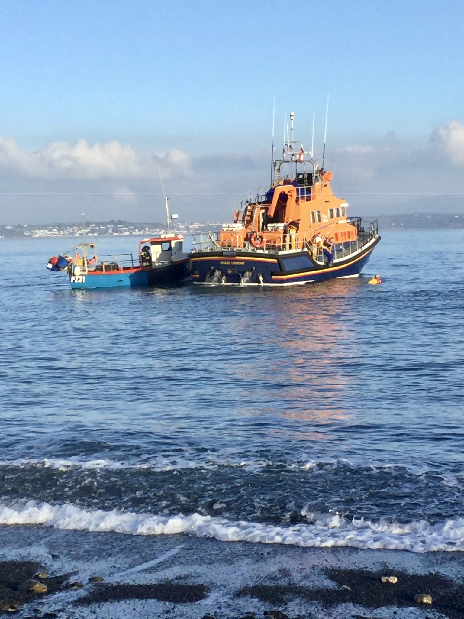 Picture supplied by RLNI of its lifeboat Ivan Ellen rescuing fisherman Nathan Rogers