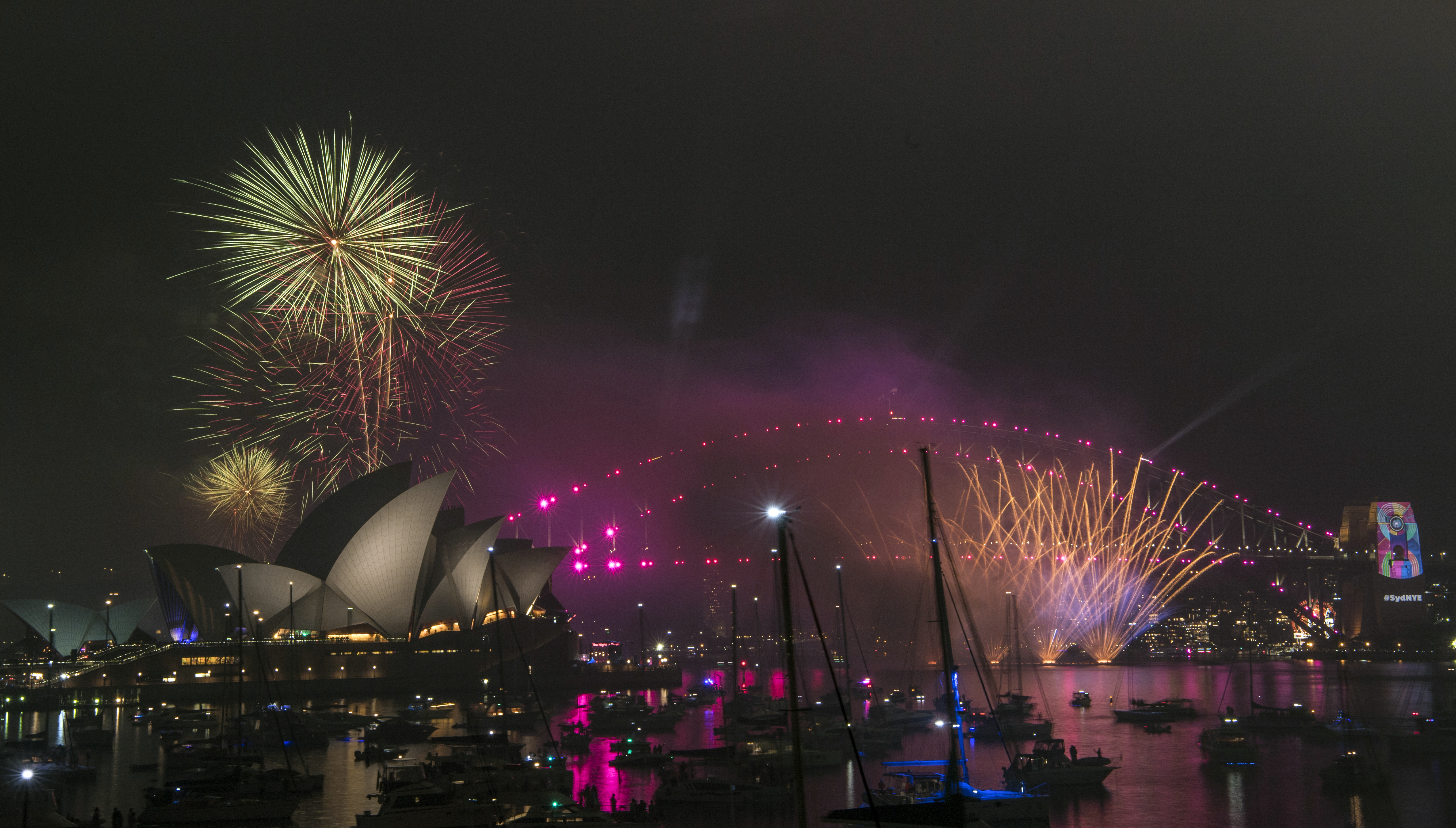 Fireworks explode over the Sydney Harbour during New Year's Eve celebrations in Sydney