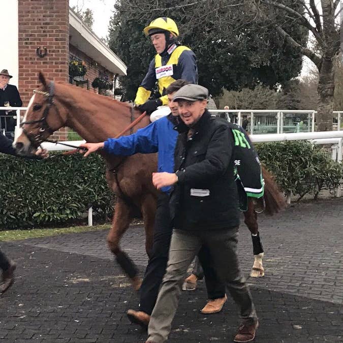 Jeremy Kyle (left) walks in with his star Glen Rocco following victory at Kempton