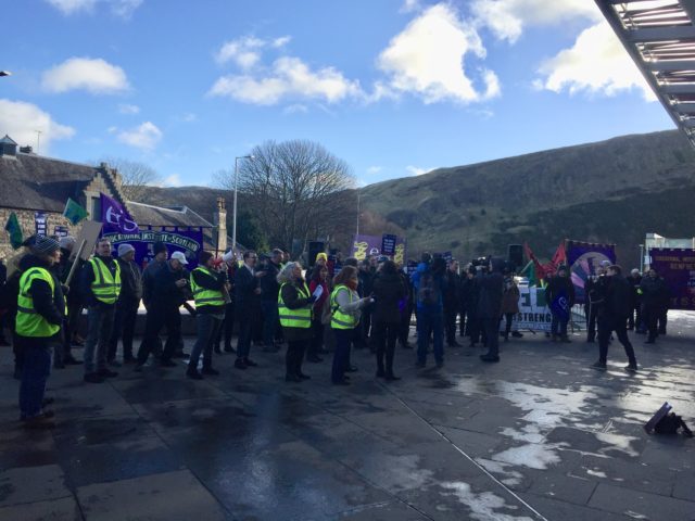 Striking Scottish college lecturers protesting outside the Scottish Parliament in Edinburgh