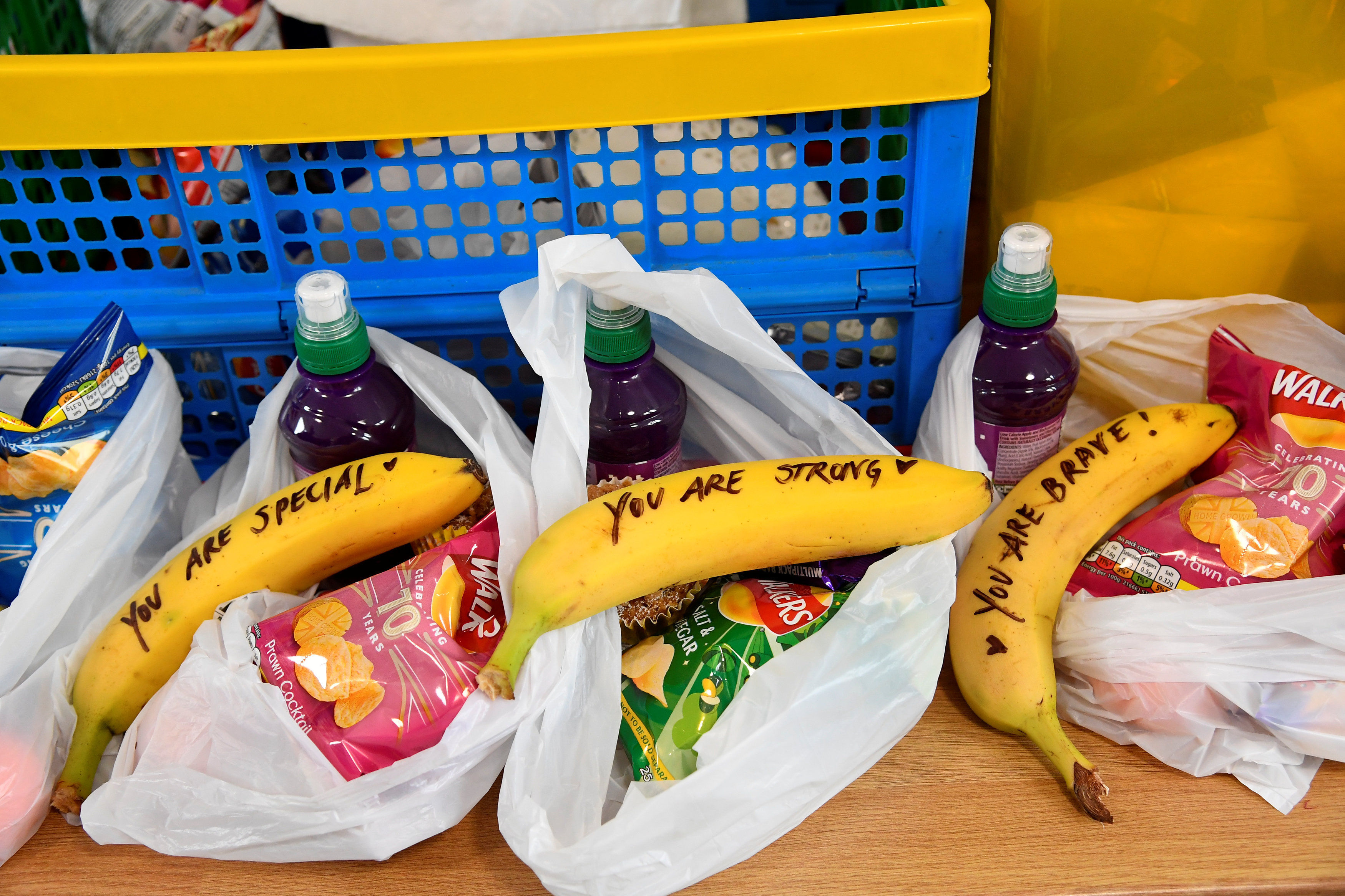 Messages written on fruit by the Duchess of Sussex when she was helping to prepare food parcels to go in the charity outreach van during her visit to One25