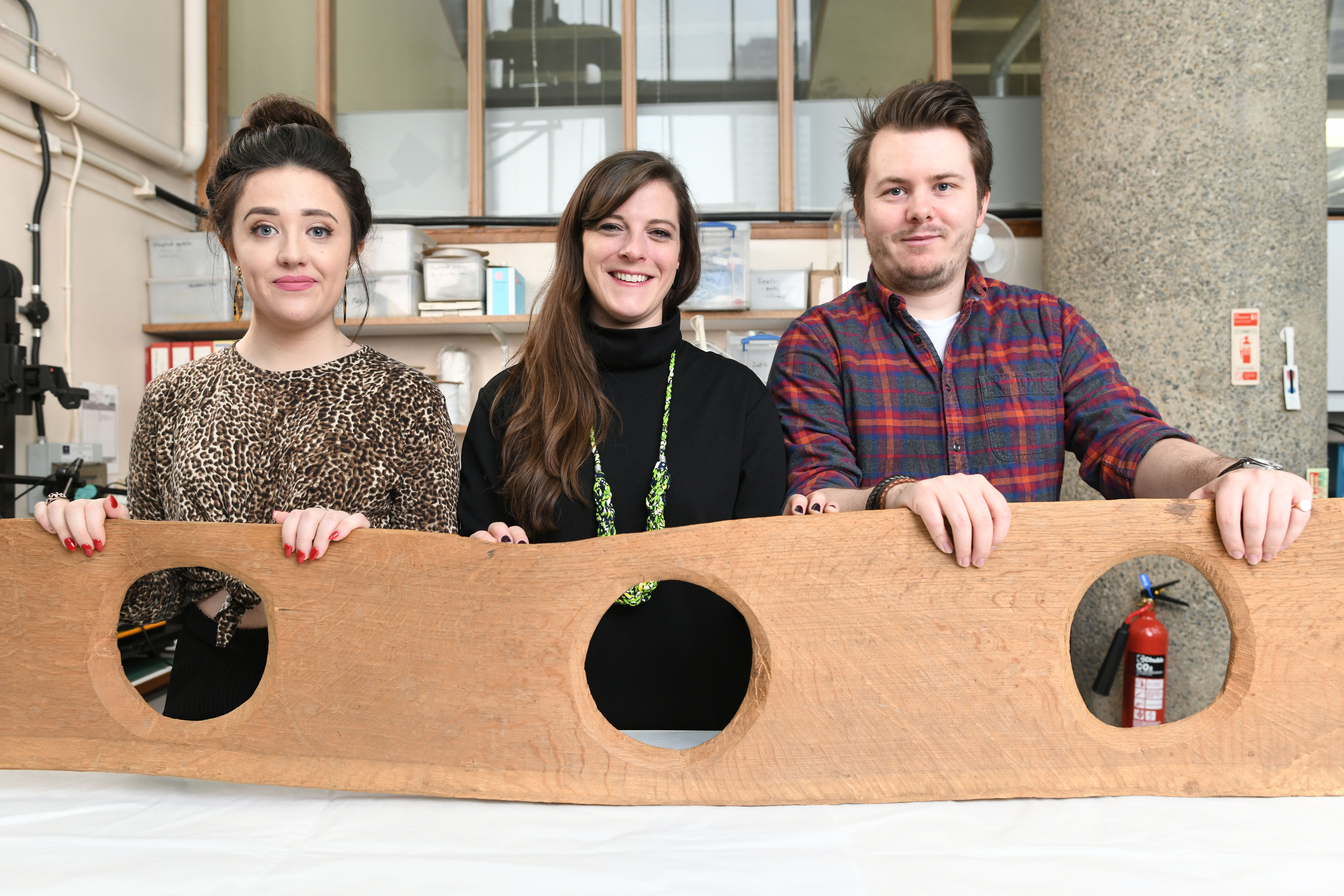 Museum staff with the replica toilet seat