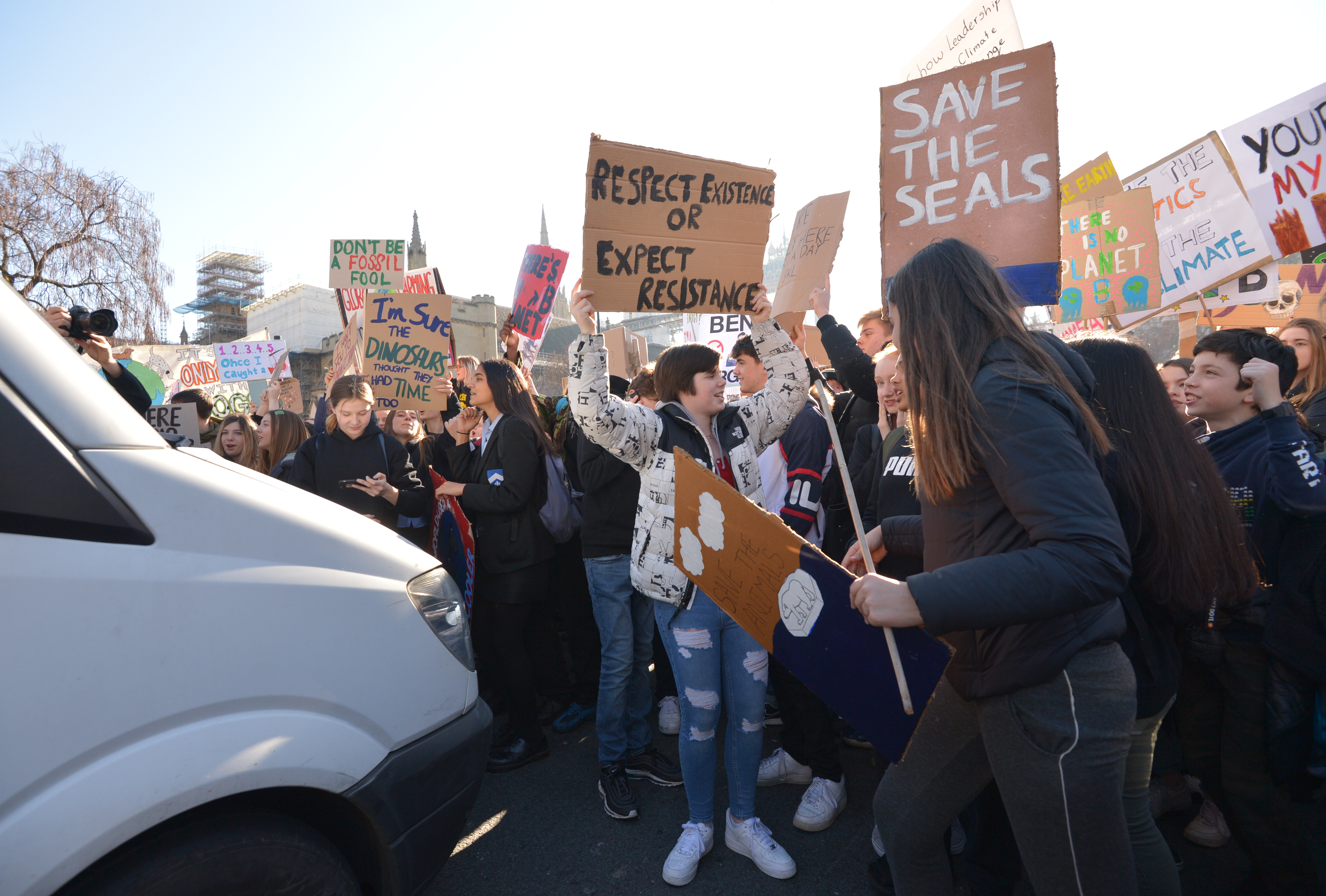 Students from the Youth Strike 4 Climate movement blocking traffic during a climate change protest on Parliament Square in Westminster, London