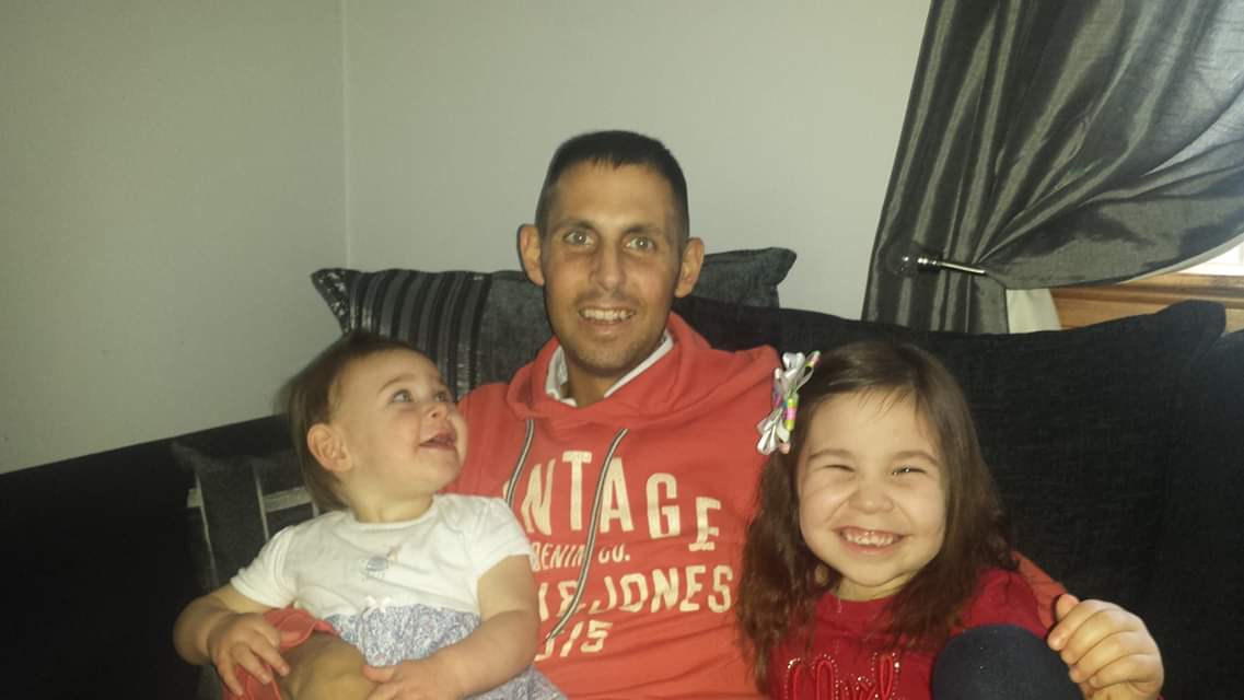 Mr Sutherland with his daughters, after coming out of a coma (Family handout/ PA)