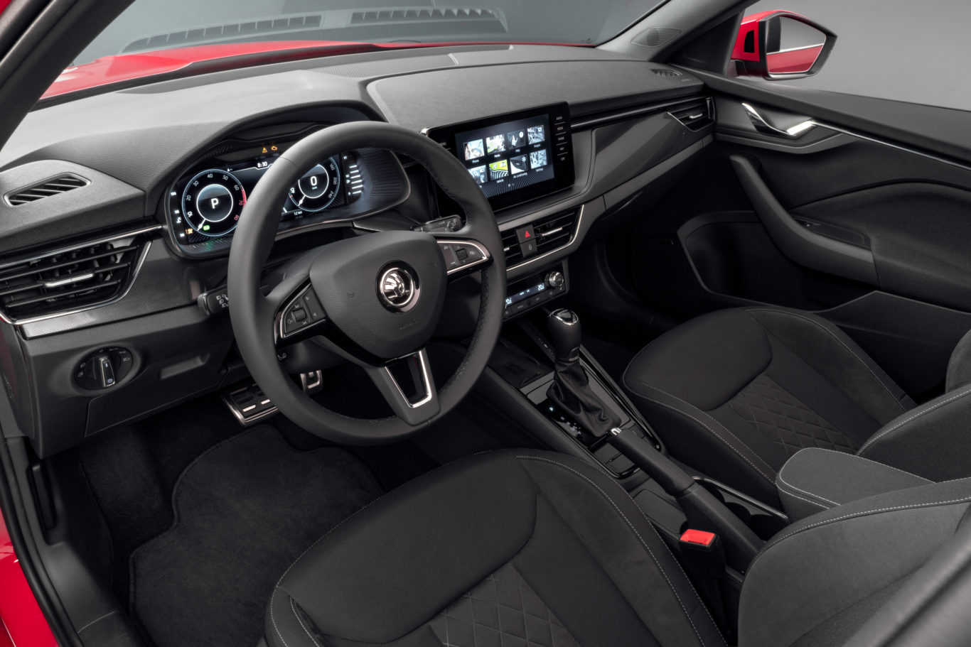 The Kamiq's interior features a large central infotainment screen