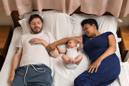 Parents should keep duvets and pillows away when sharing with their baby (Infant Sleep Information Source/ Rob Mank/ PA)