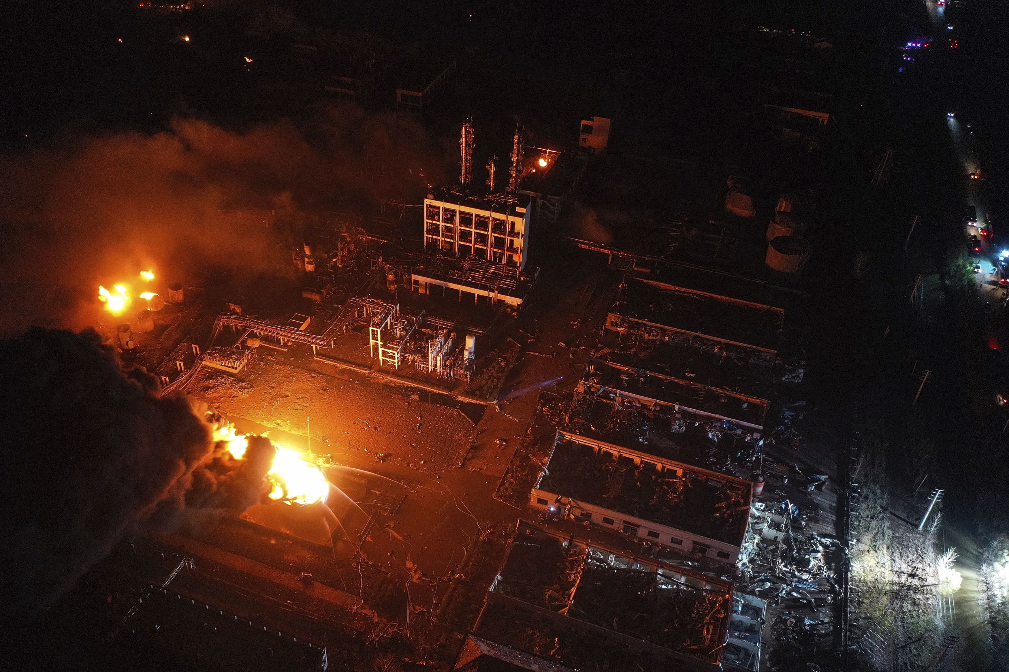 Aerial photo released by China's Xinhua News Agency, fires burn at the site of a factory explosion in a chemical industrial park in Xiangshui County of Yancheng in eastern China's Jiangsu province