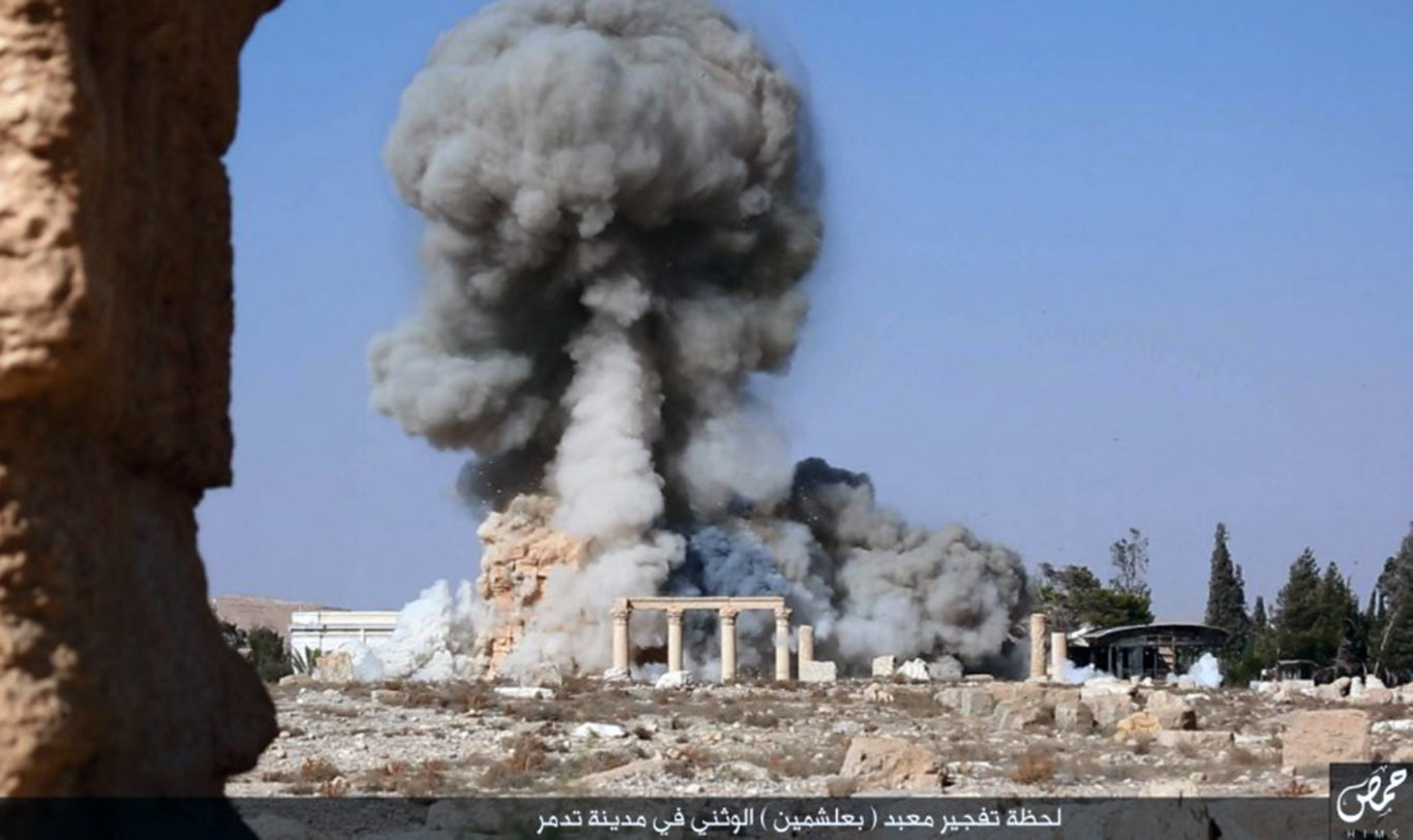 Explosions at the 2,000-year-old temple of Baalshamin in Syria's ancient caravan city of Palmyra (IS/AP)