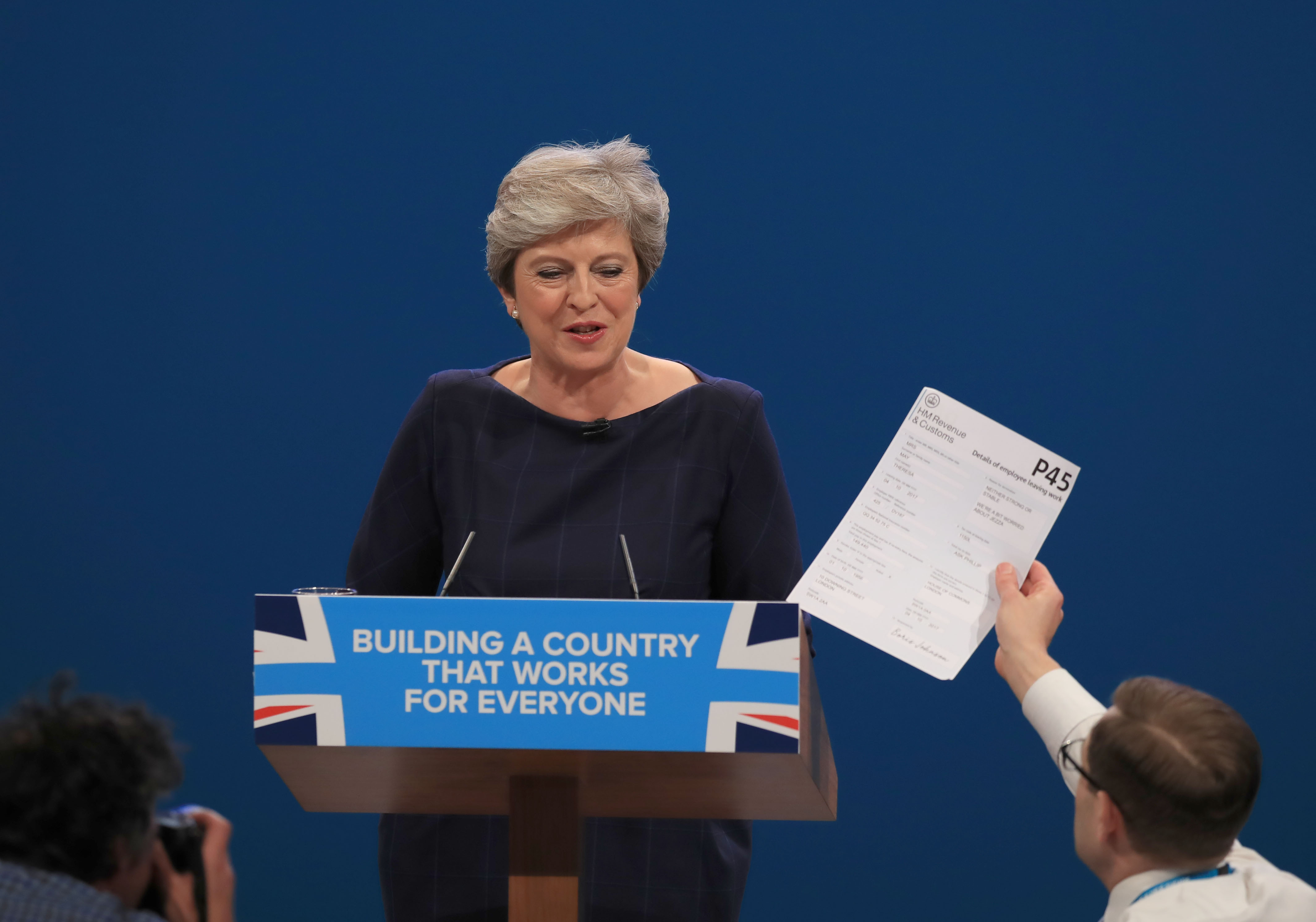 Comedian Simon Brodkin interrupted Mrs May's disastrous conference speech in Manchester