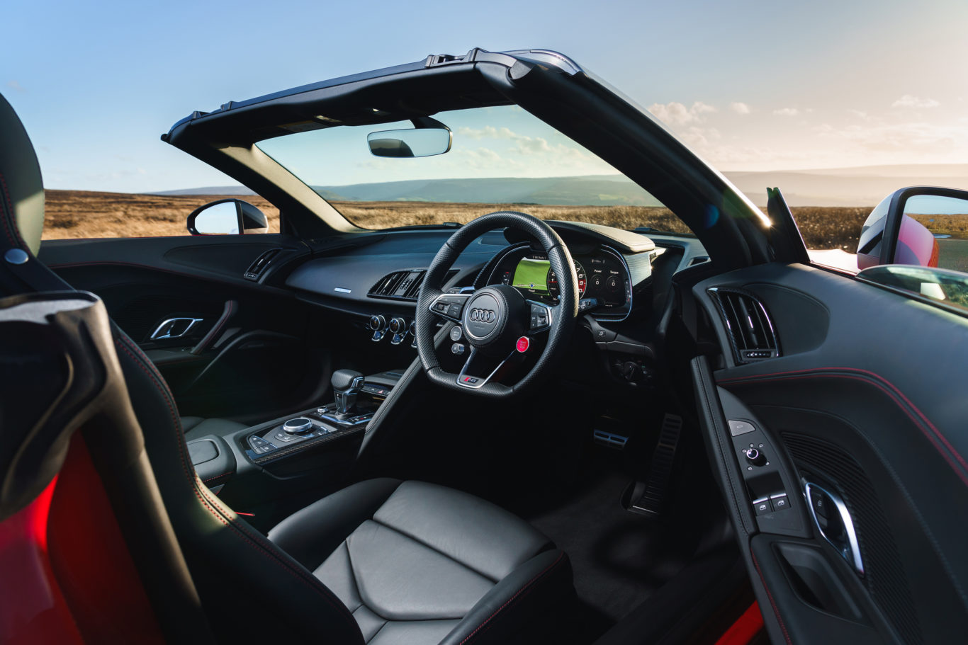 The Spyder's cabin is more compact than the one in the Coupe