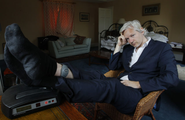 Assange with his ankle security tag at a house  near Bungay