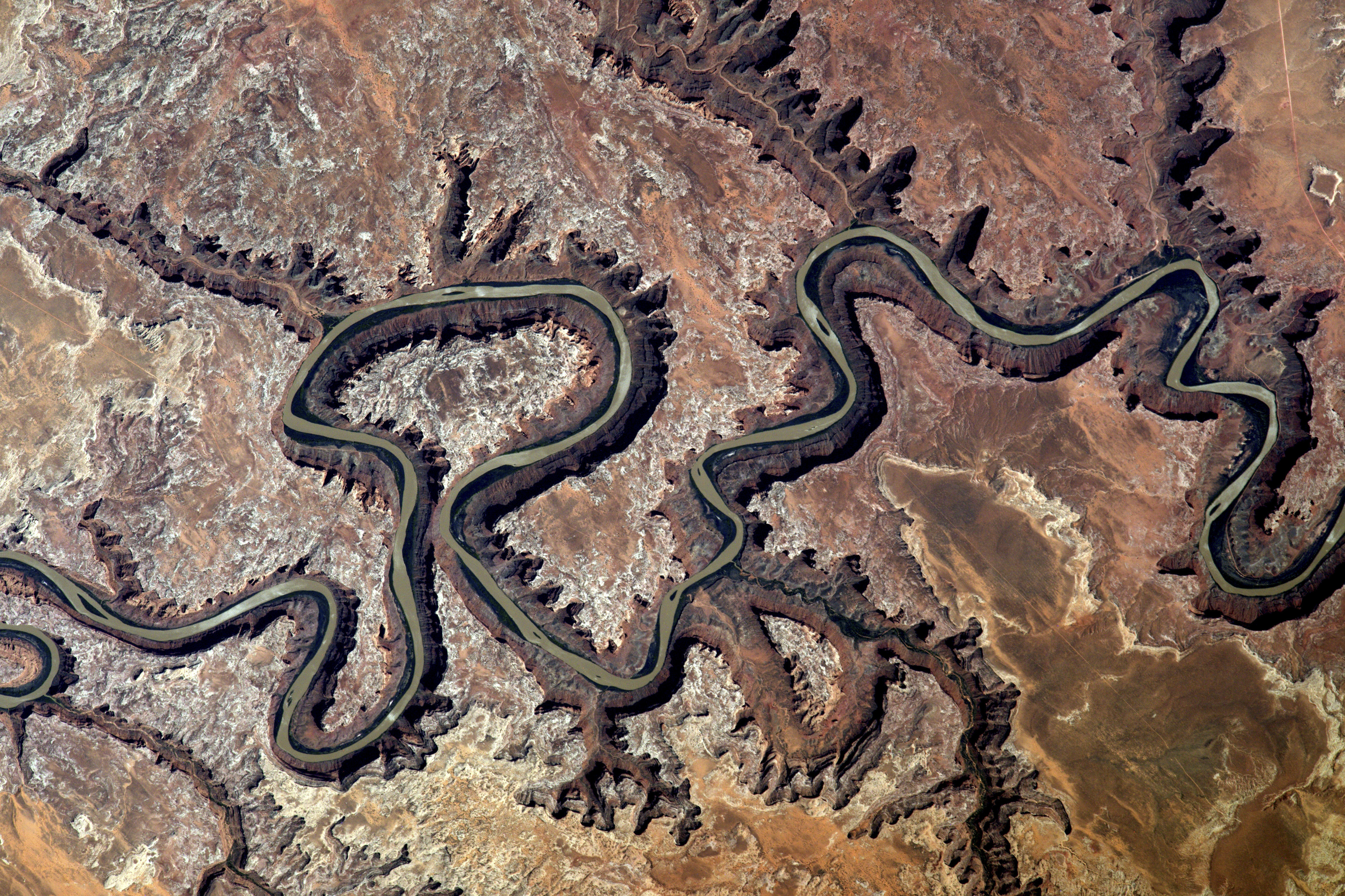 The Green River carves a canyon 300 metres deep as it snakes its way across Utah's landscape (NASA/PA) 