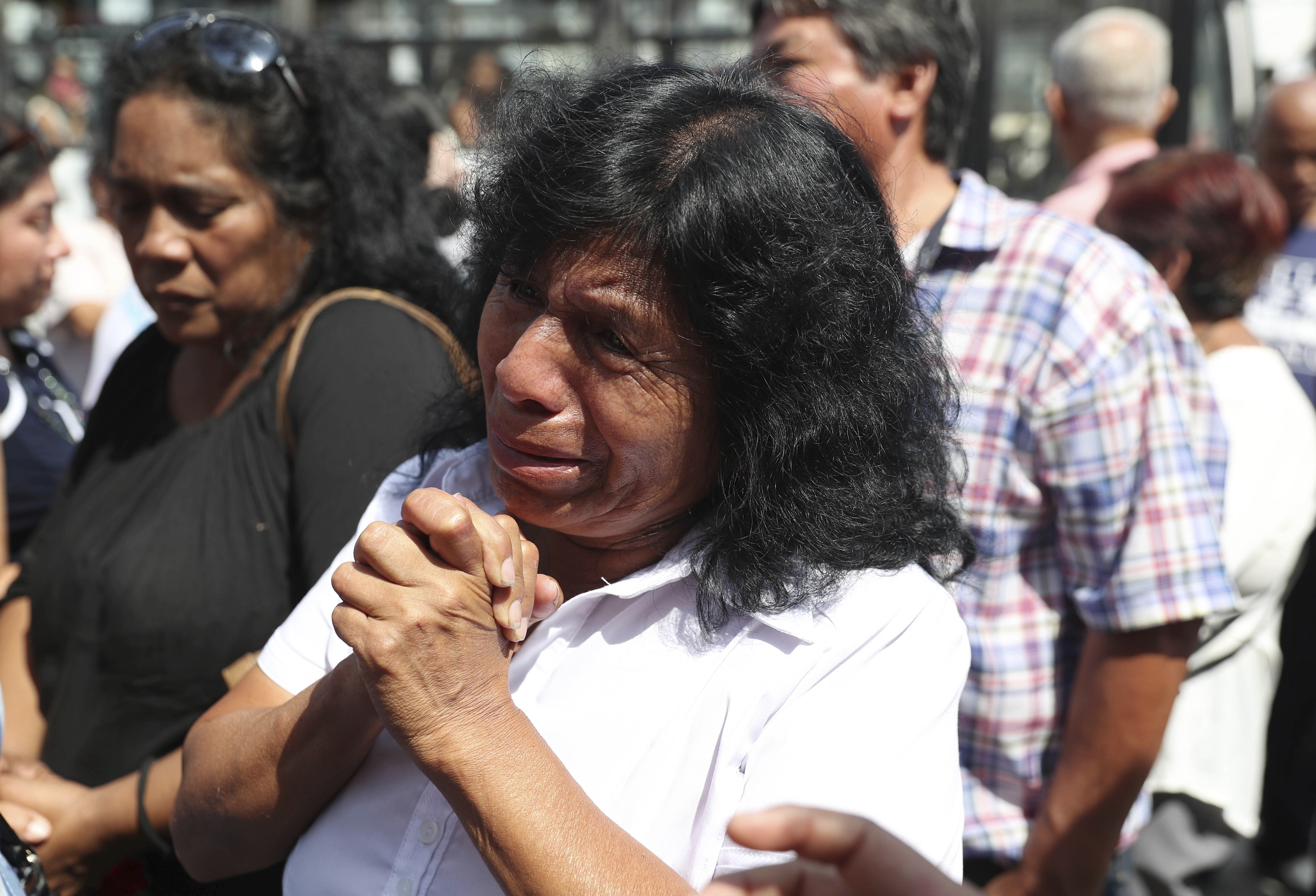 A supporter of former Peruvian President Alan Garcia grieves after learning of his death