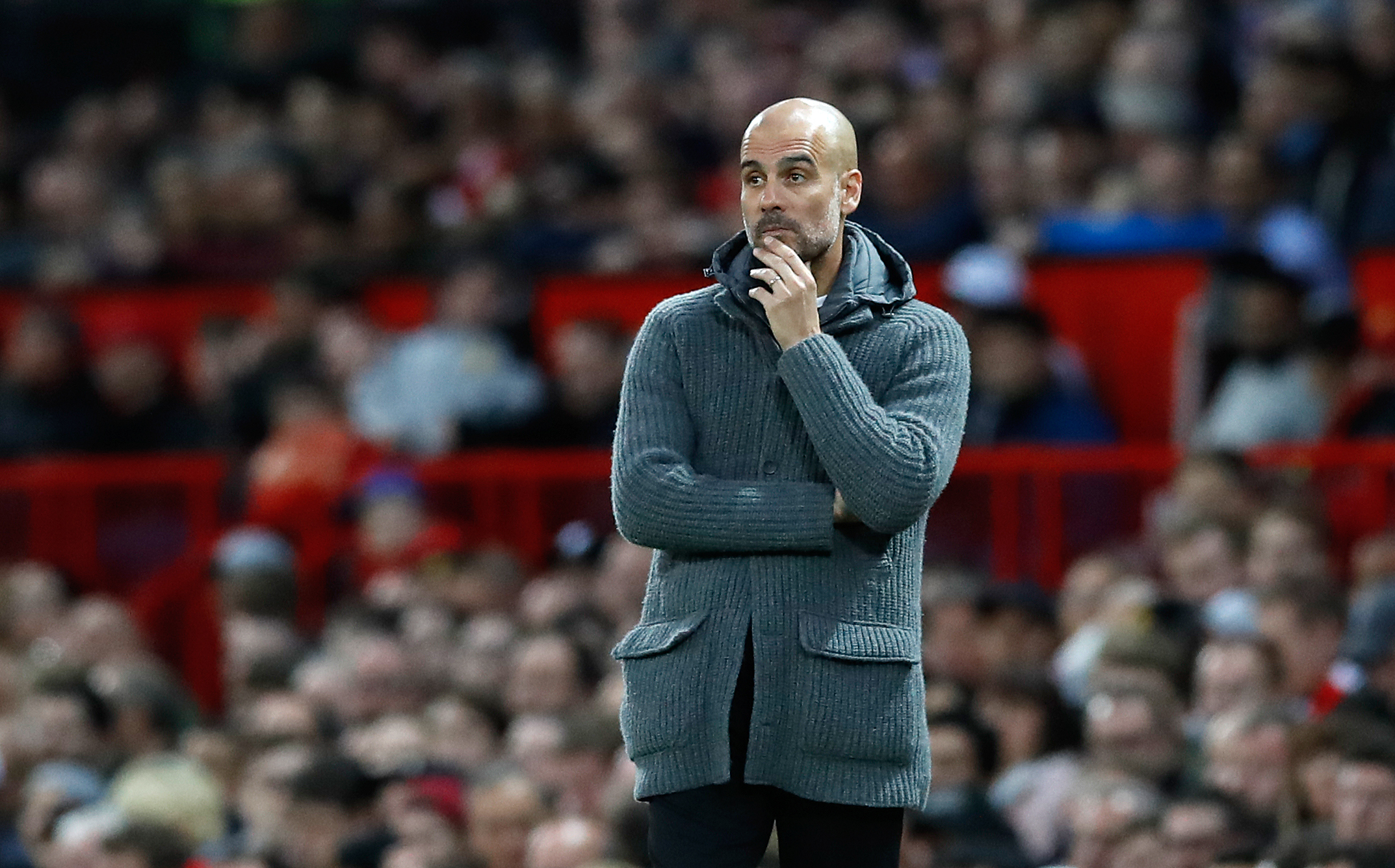 Manchester City manager Pep Guardiola on the touchline during a Premier League match at Old Trafford, Manchester