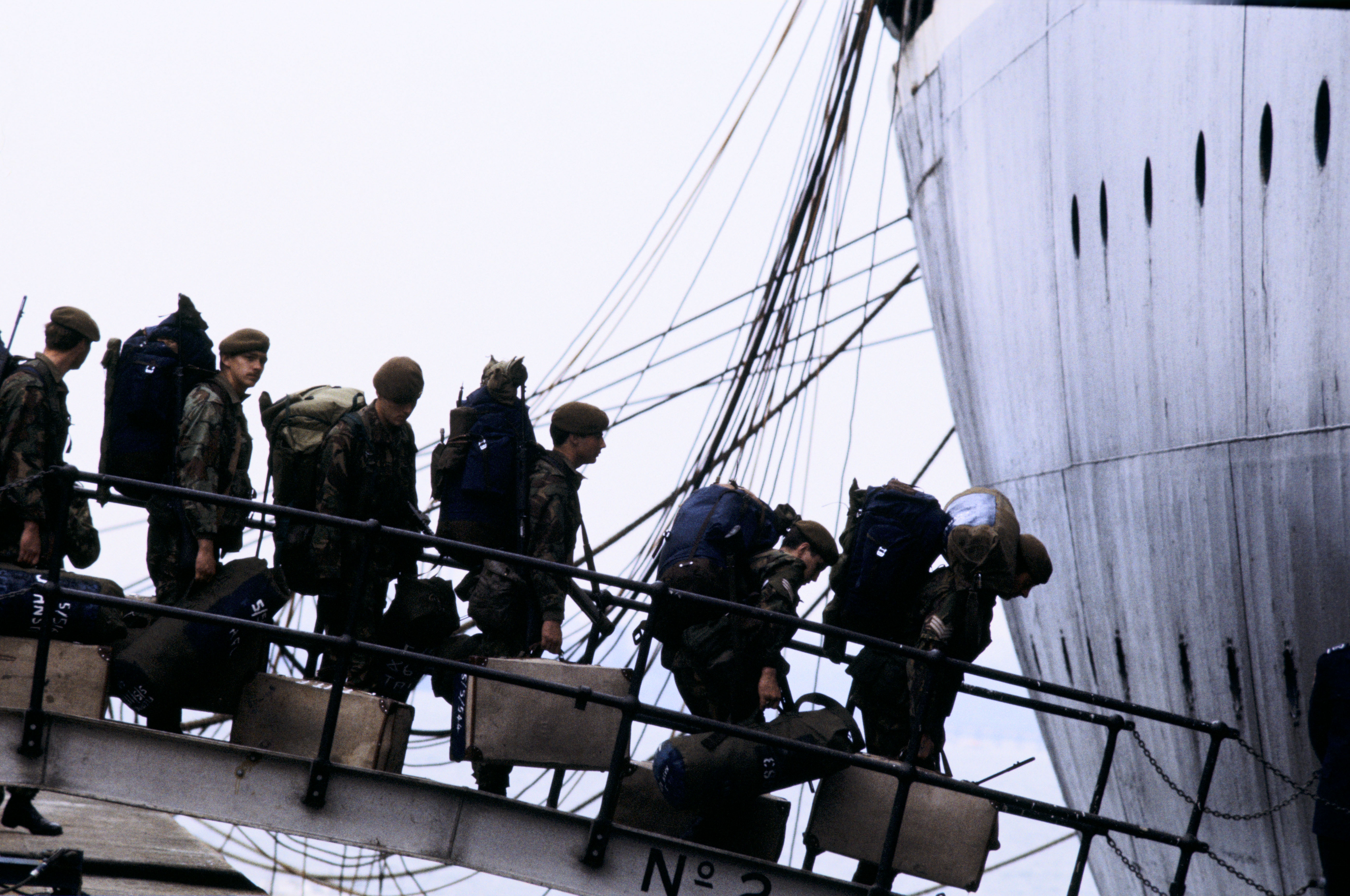 Falklands soldiers boarding the QE2 (Barry Lewis/PA)