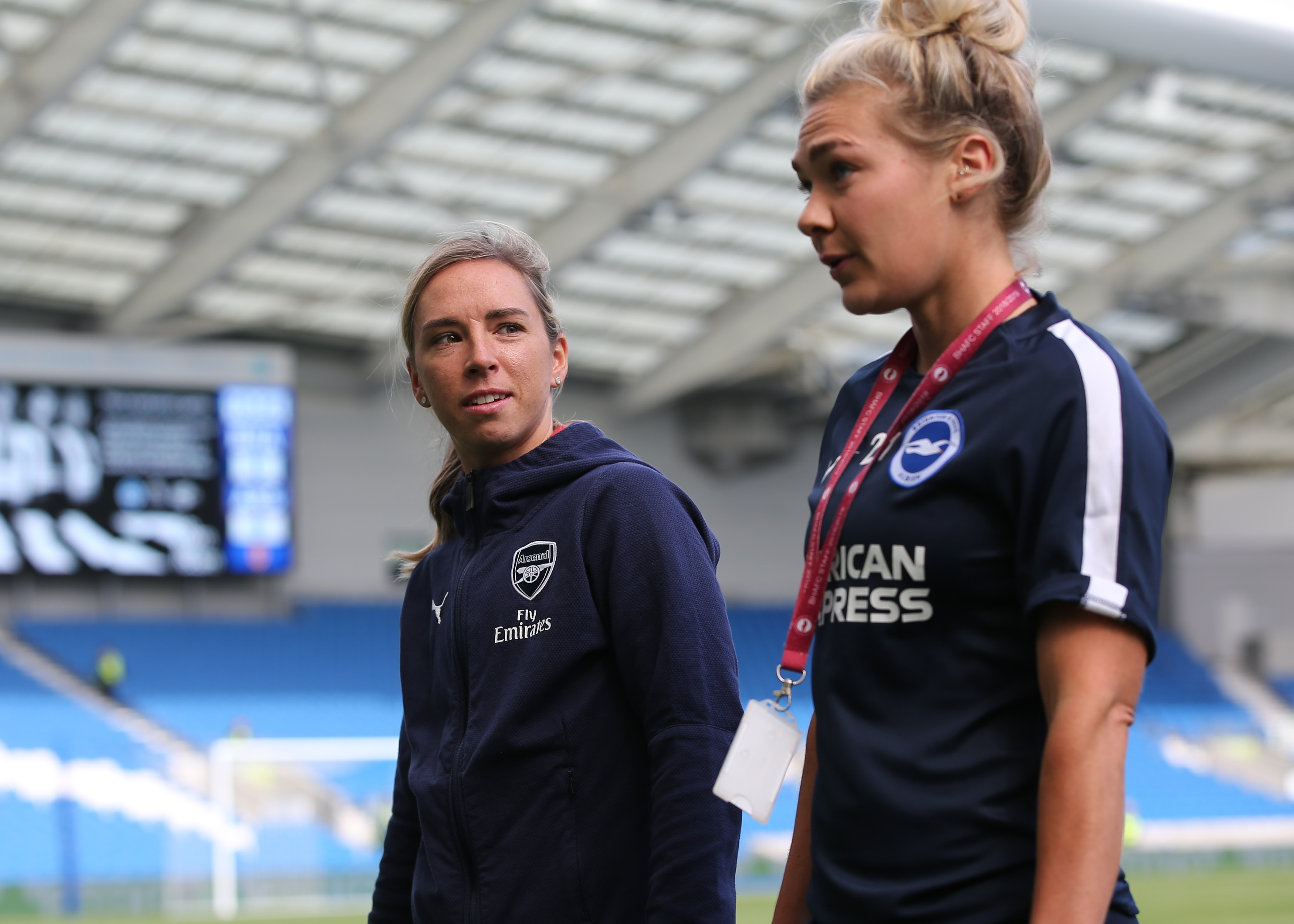 Arsenal's Jordan Nobbs (left) talks with Brighton's Emily Simpkins