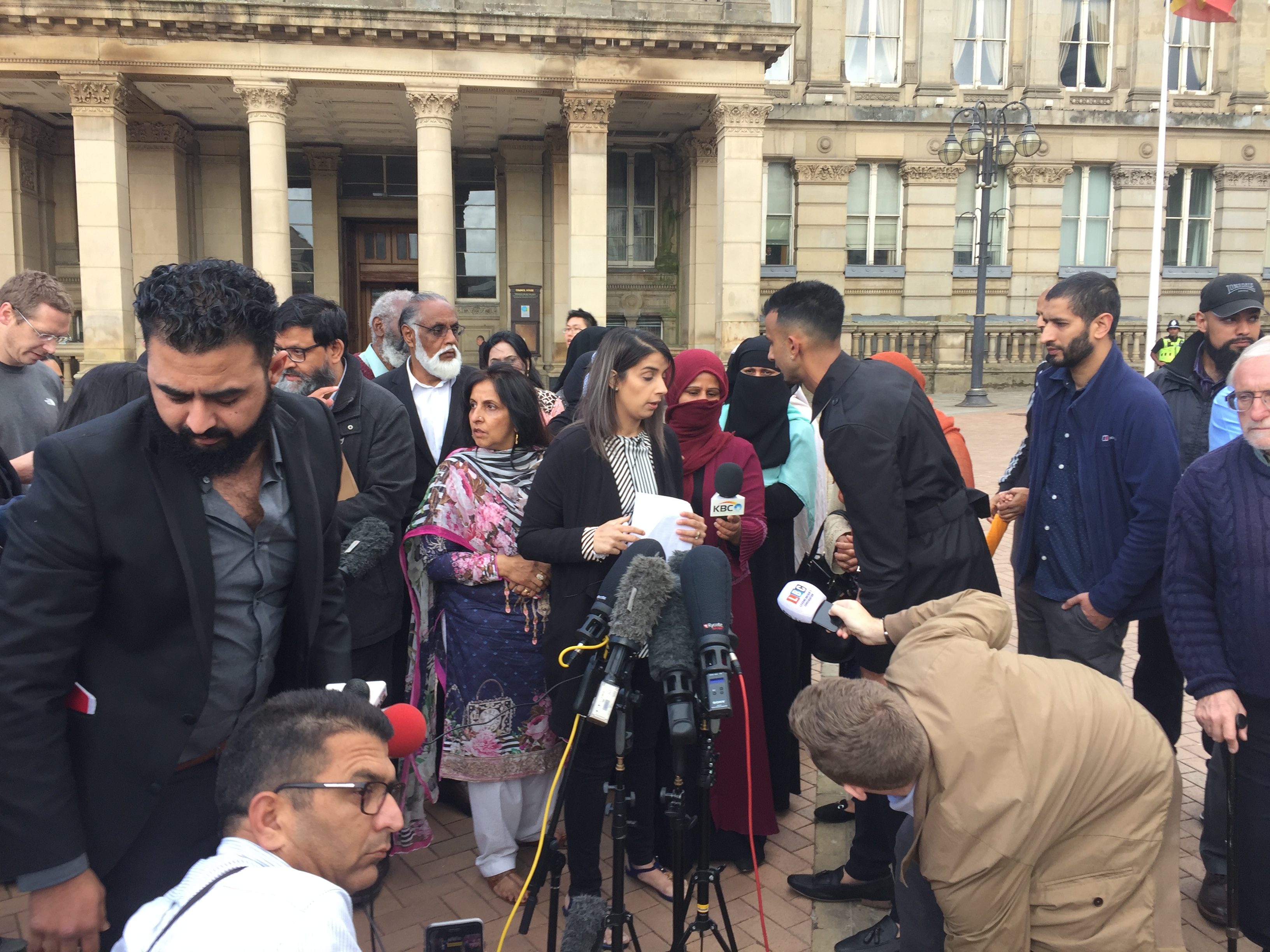 Protesters who have been demomstrating against relationship education materials being used at Anderton Park Primary School, hold a press conference in Birmingham city centre