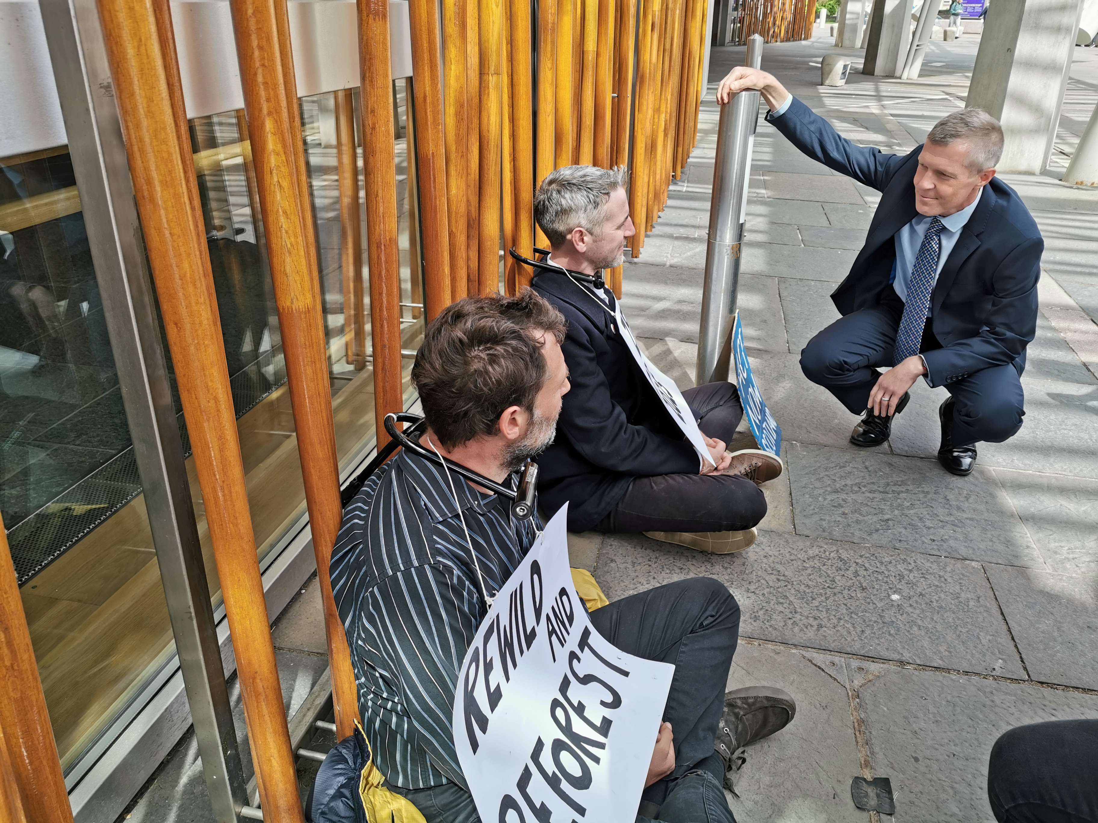 Five climate change activists were locked to the Scottish Parliament in Edinburgh and the keys sent to party leaders (Tom Eden/PA)