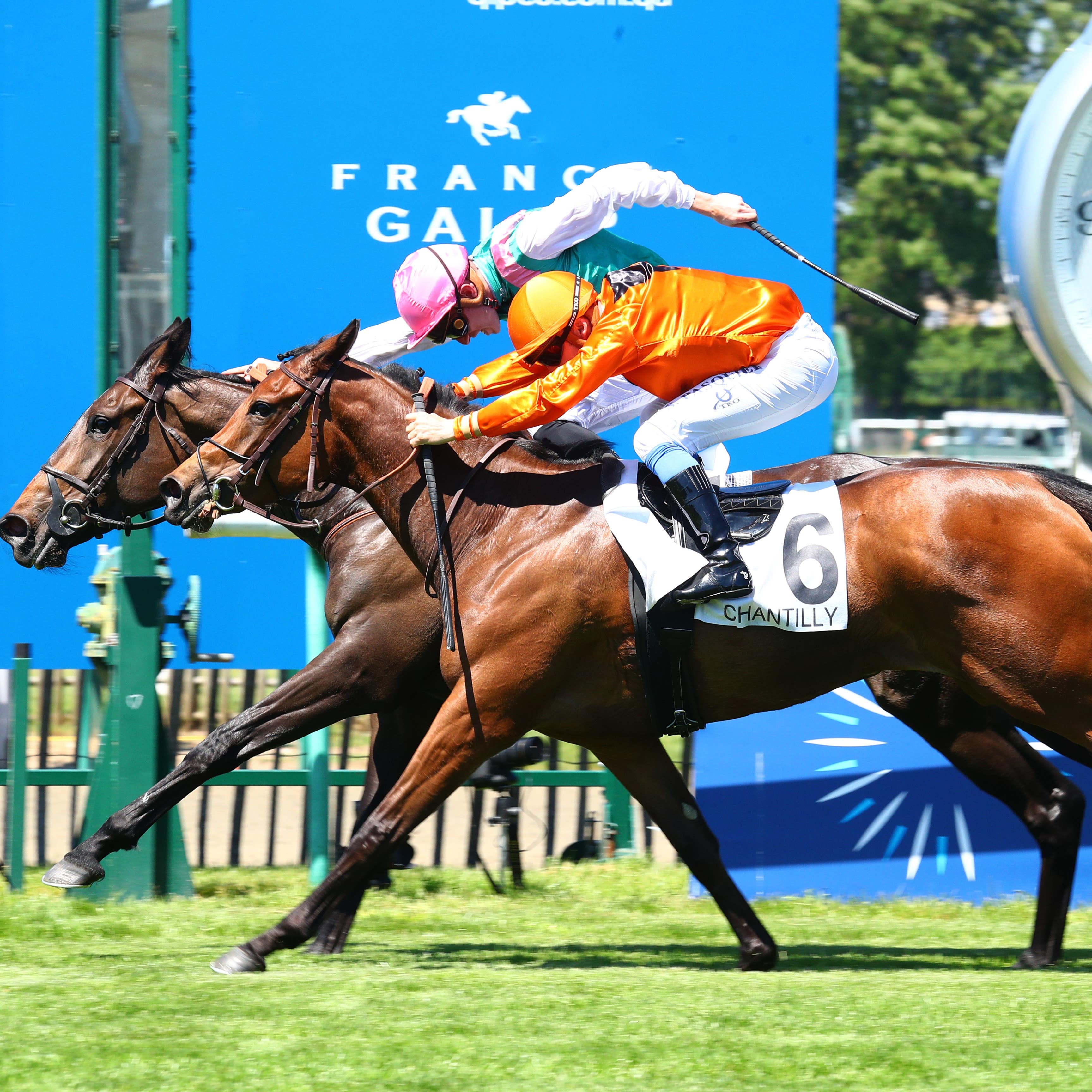 Obligate (pink hat) just held on in the Prix de Sandringham