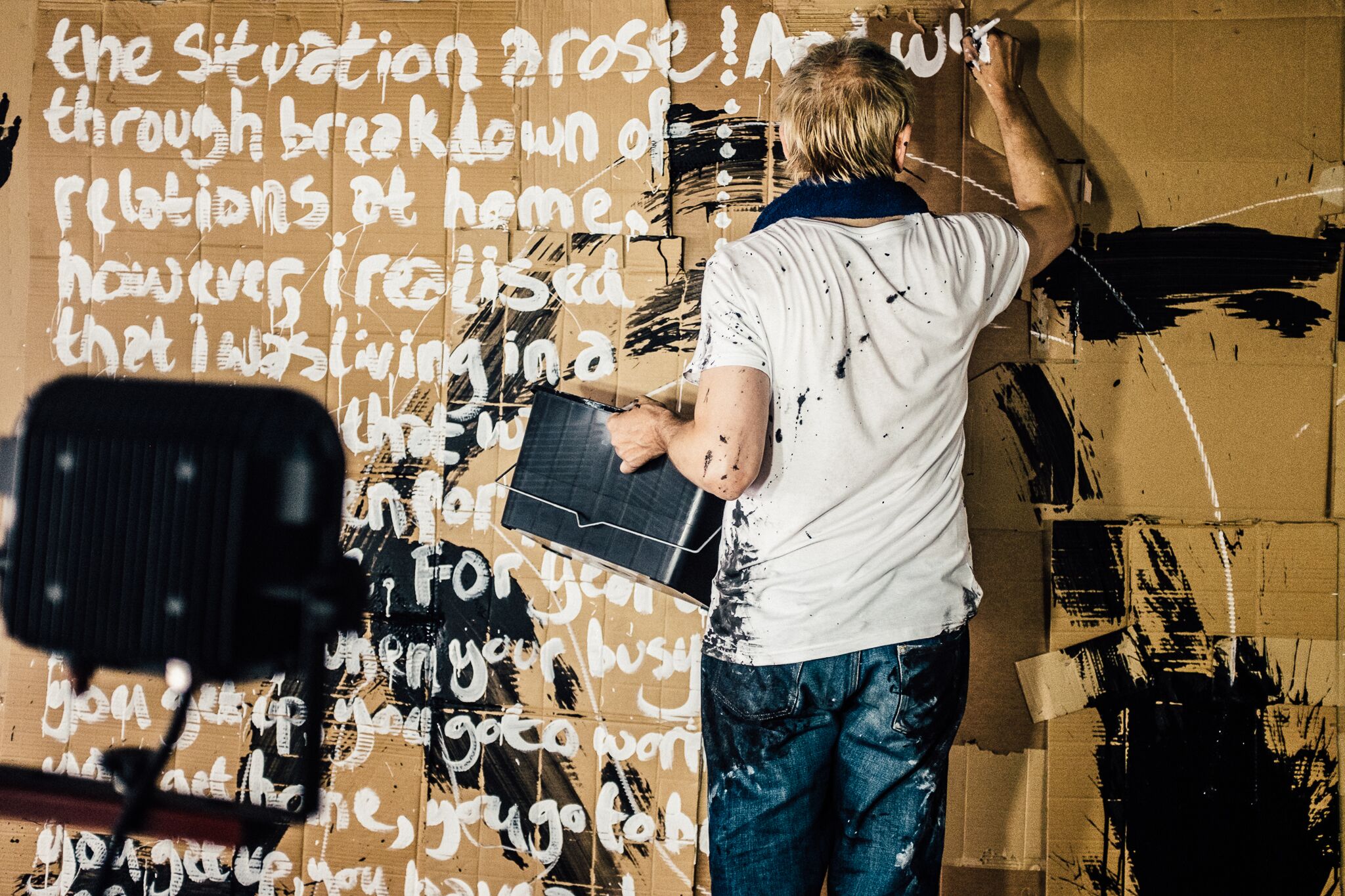 Karl Hyde covers a wall with words and phrases drawn from the street