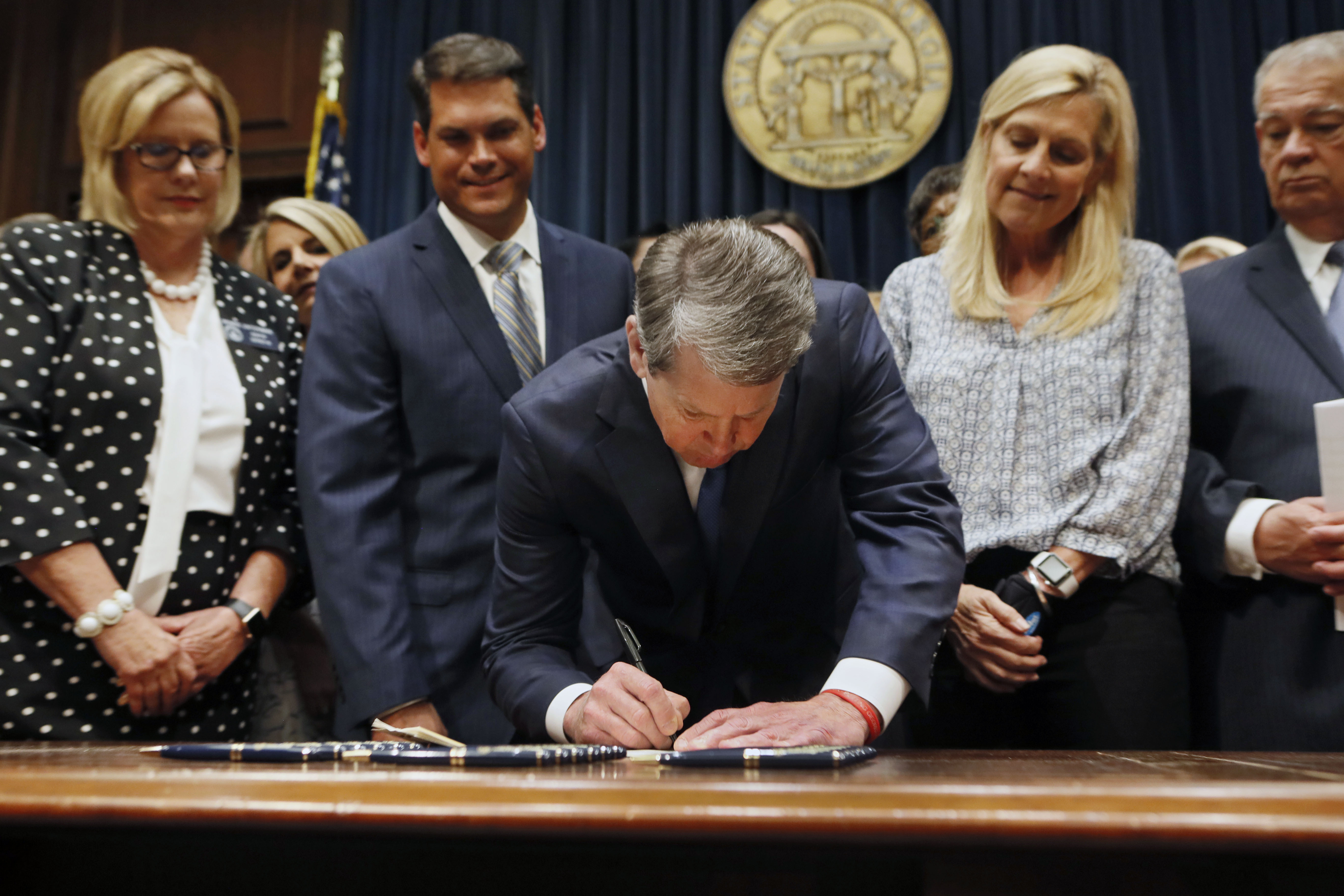 Brian Kemp signs the legislation