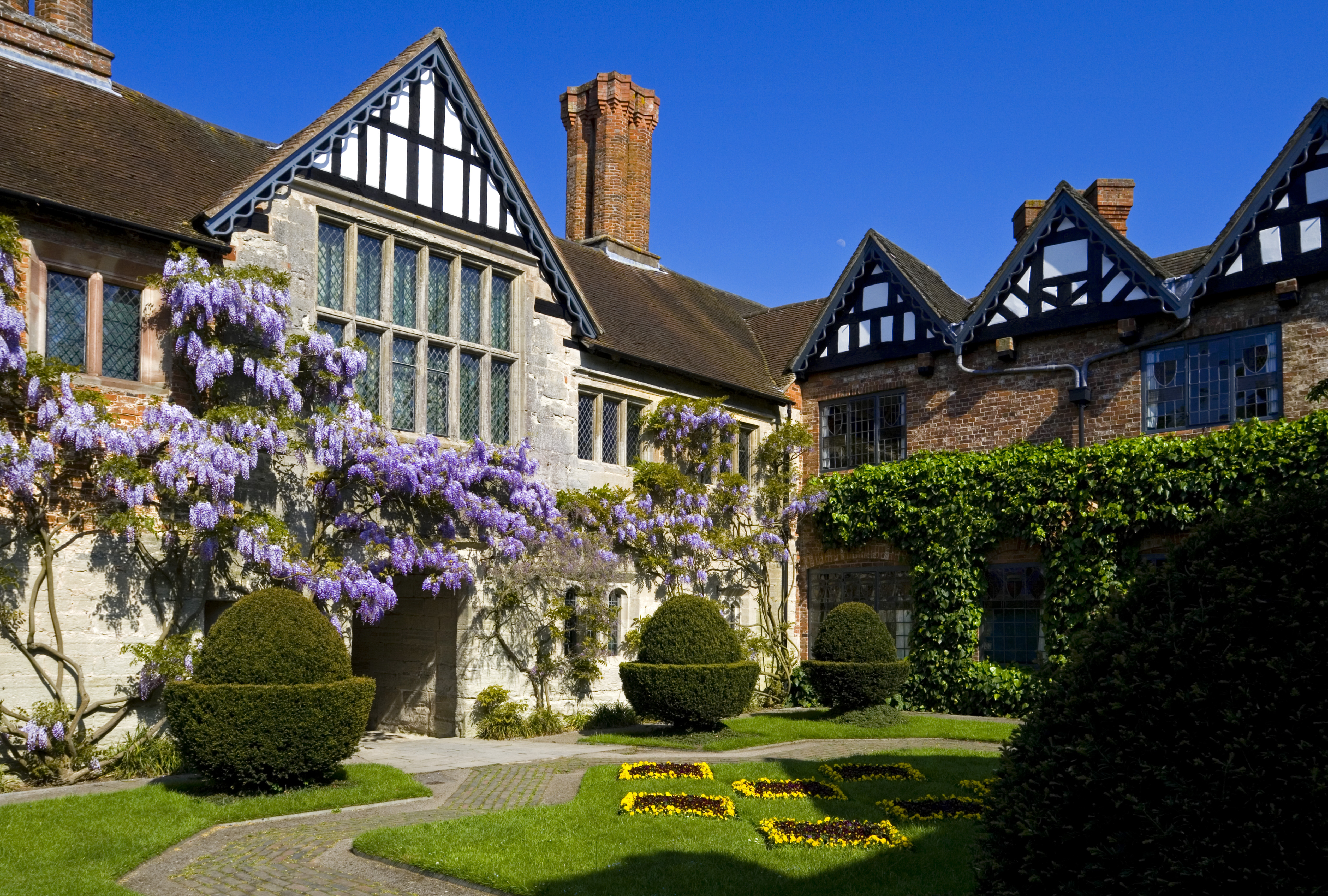 The Trust uses returns from its investments to help look after its properties including Baddesley Clinton, Warwickshire (National Trust Images/Robert Morris/PA)