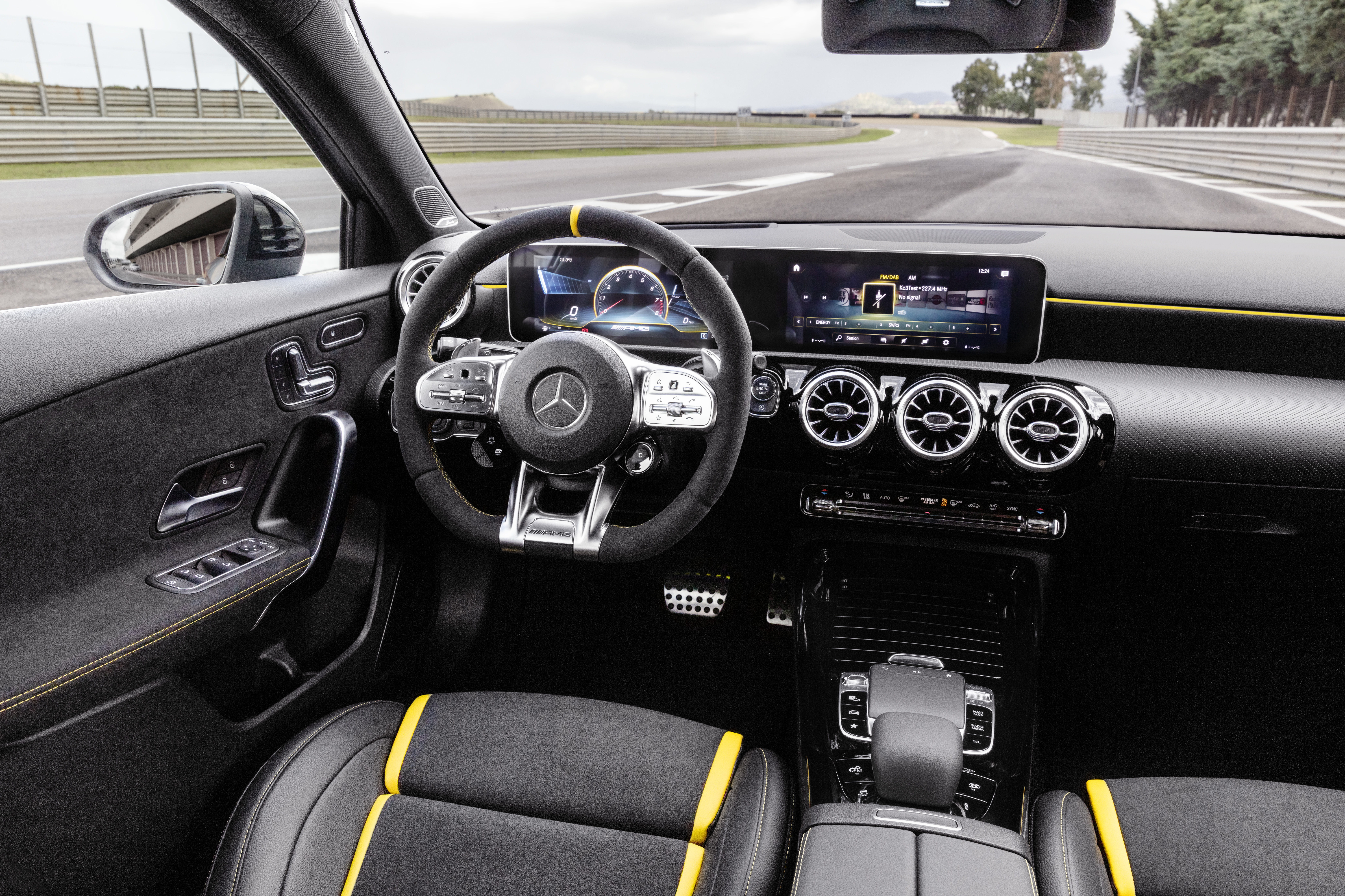 The interior features racing seats and matching steering wheel
