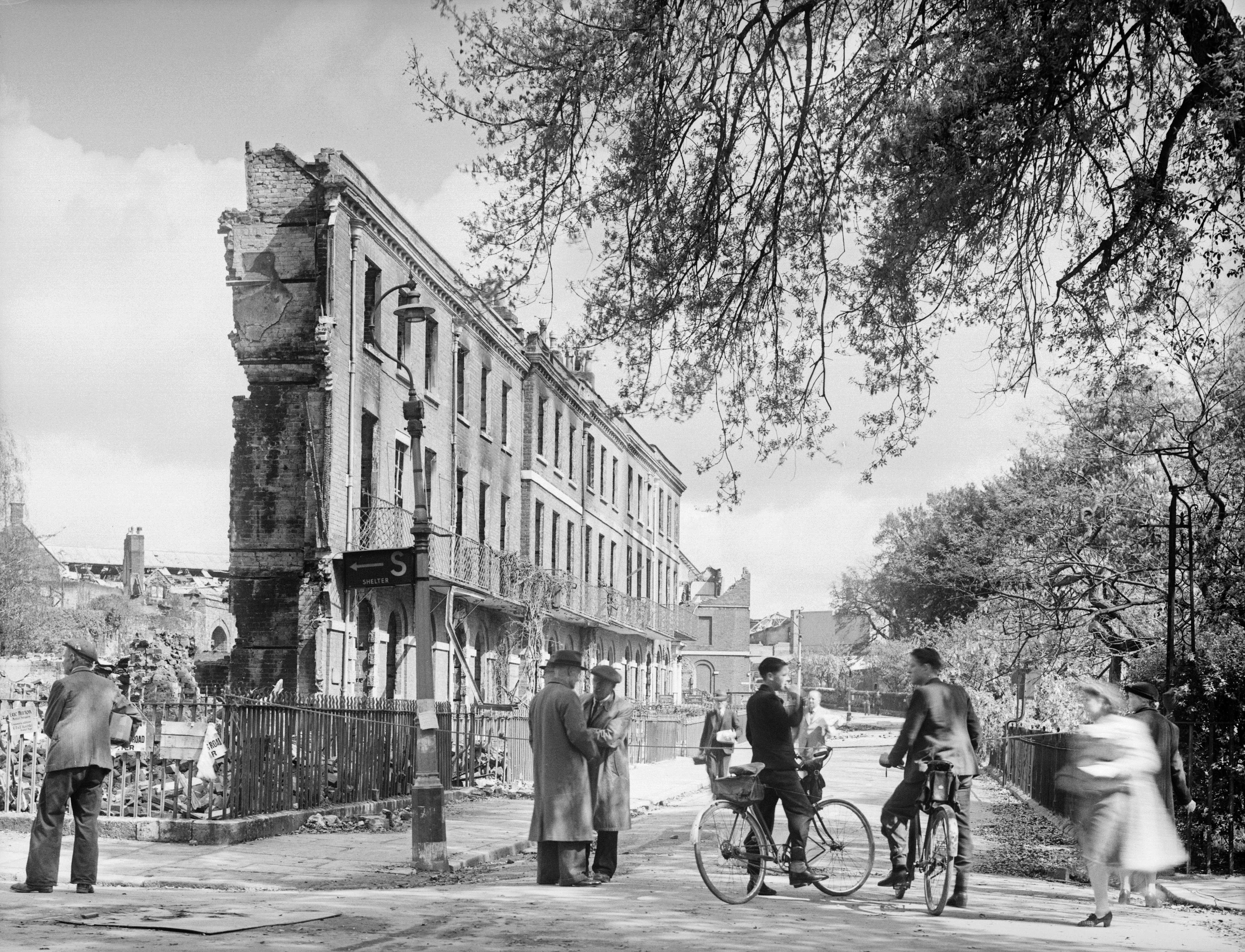 One photograph from the exhibition shows the effects of the Baedeker raids on the cathedral city of Exeter in 1942 (Historic England/PA)