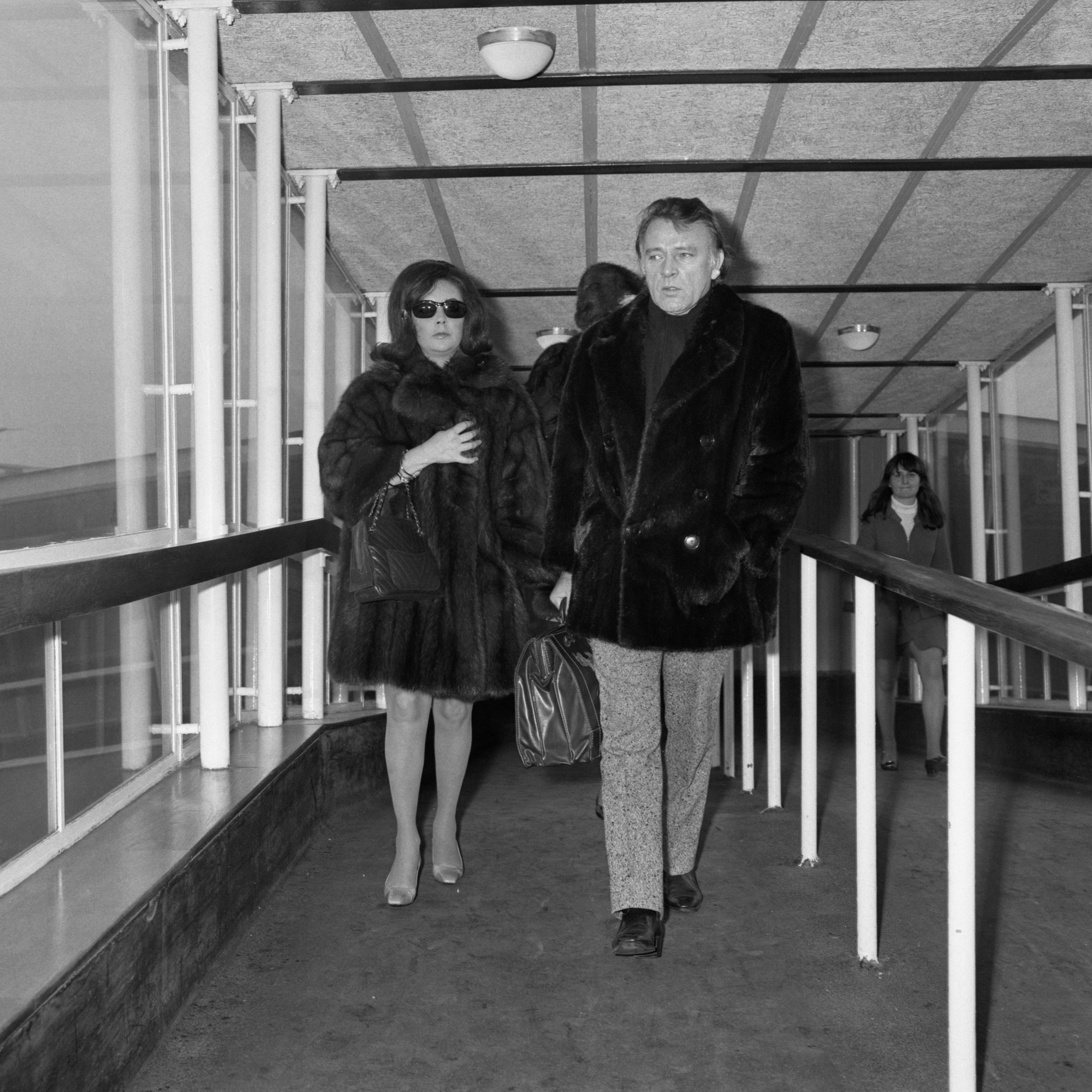 Taylor and Richard Burton in all-mink at Heathrow airport in 1969