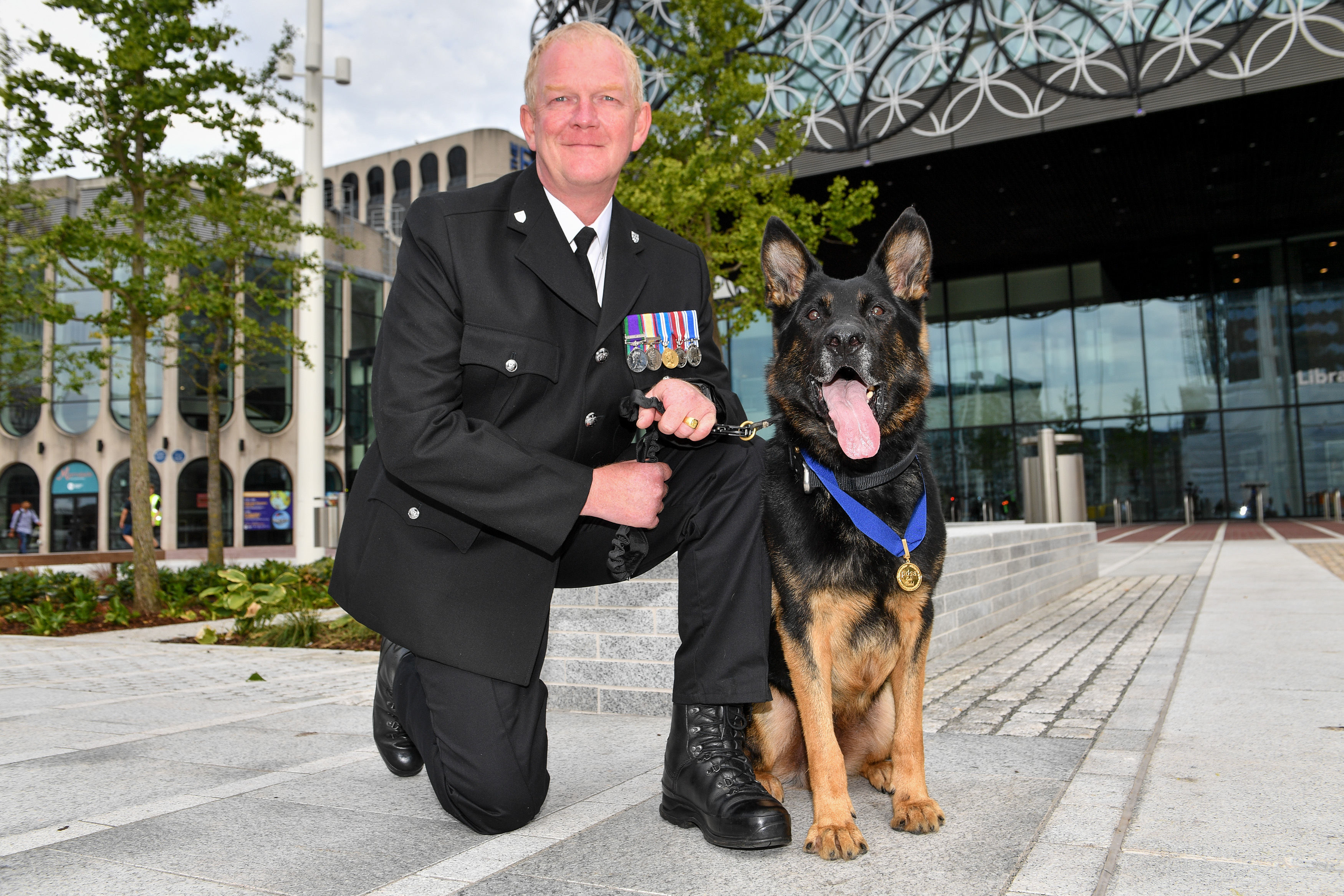 Police dog that ignored knife wounds to secure arrest given bravery ...