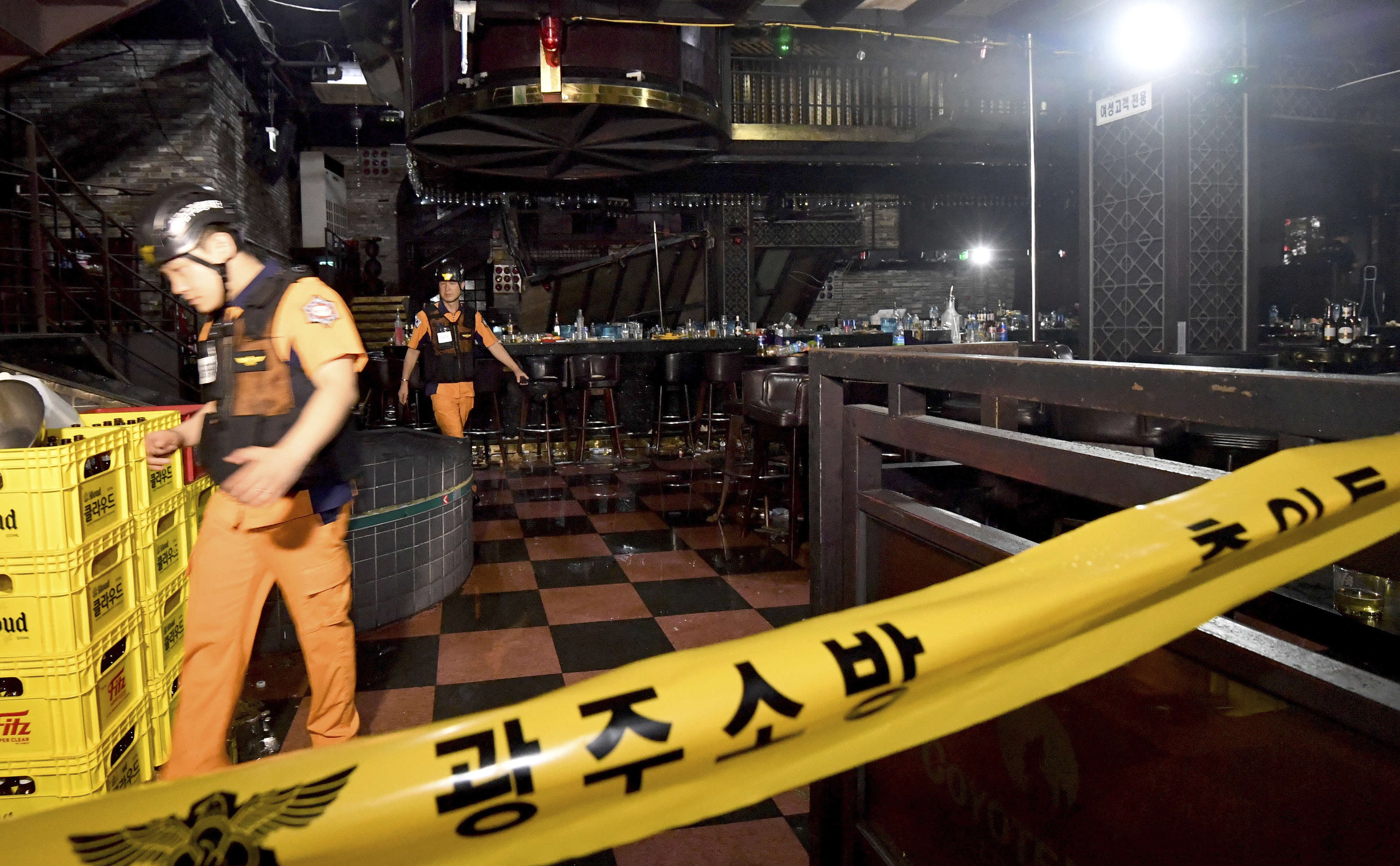 Rescue workers inspect the collapsed balcony