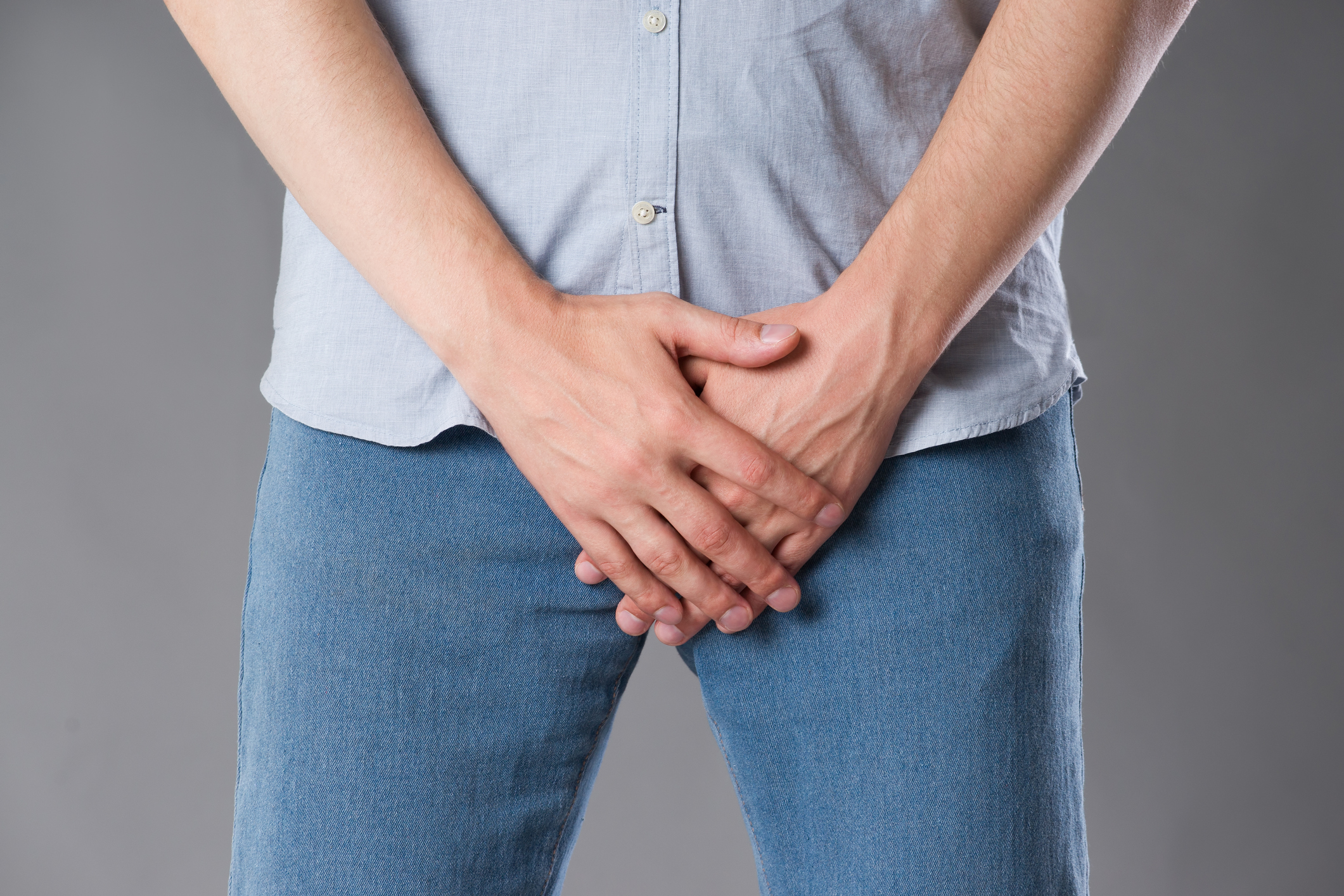 Pain in prostate, man suffering from prostatitis or from a venereal disease