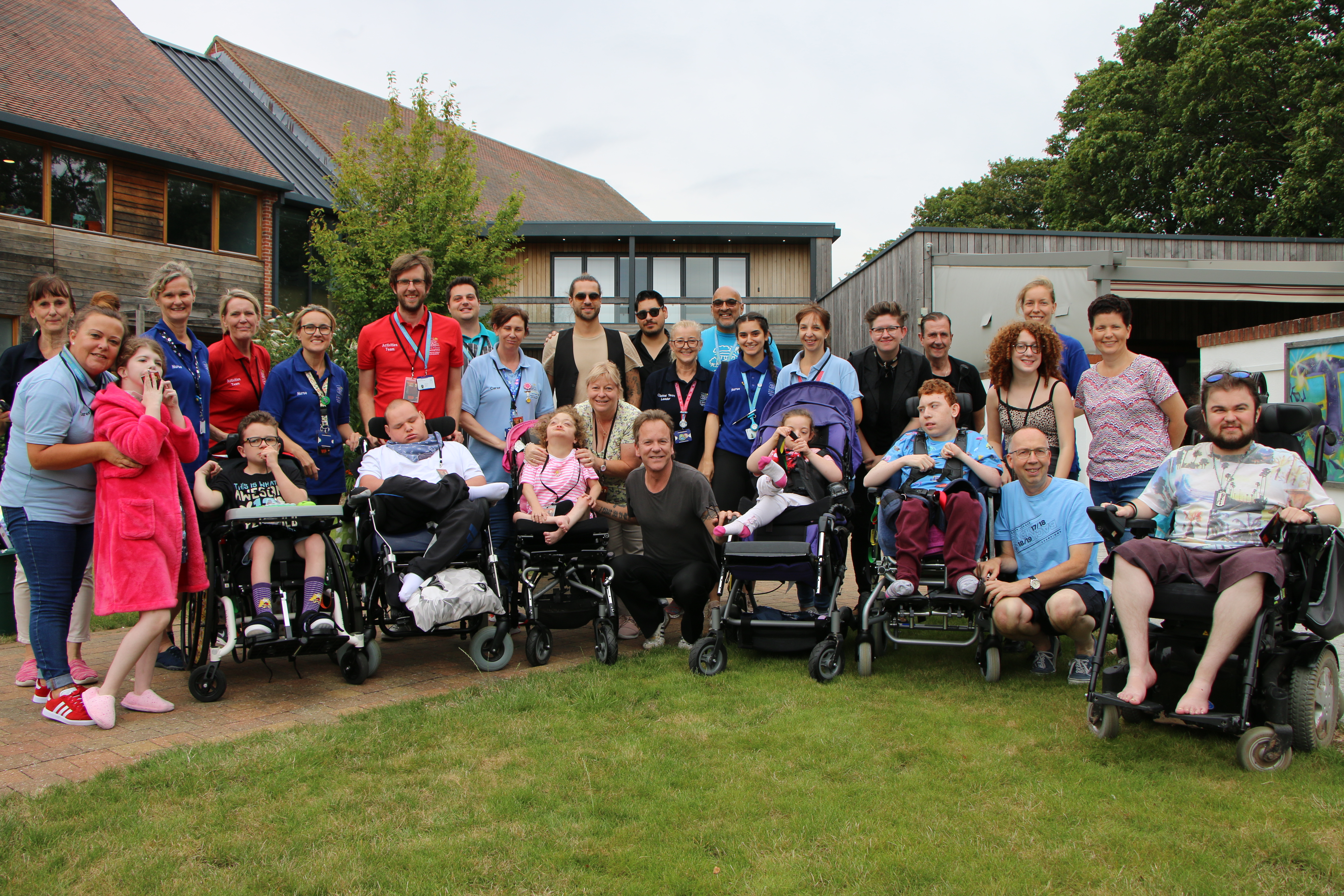 Kiefer Sutherland with kids from hospices Naomi House And Jacksplace