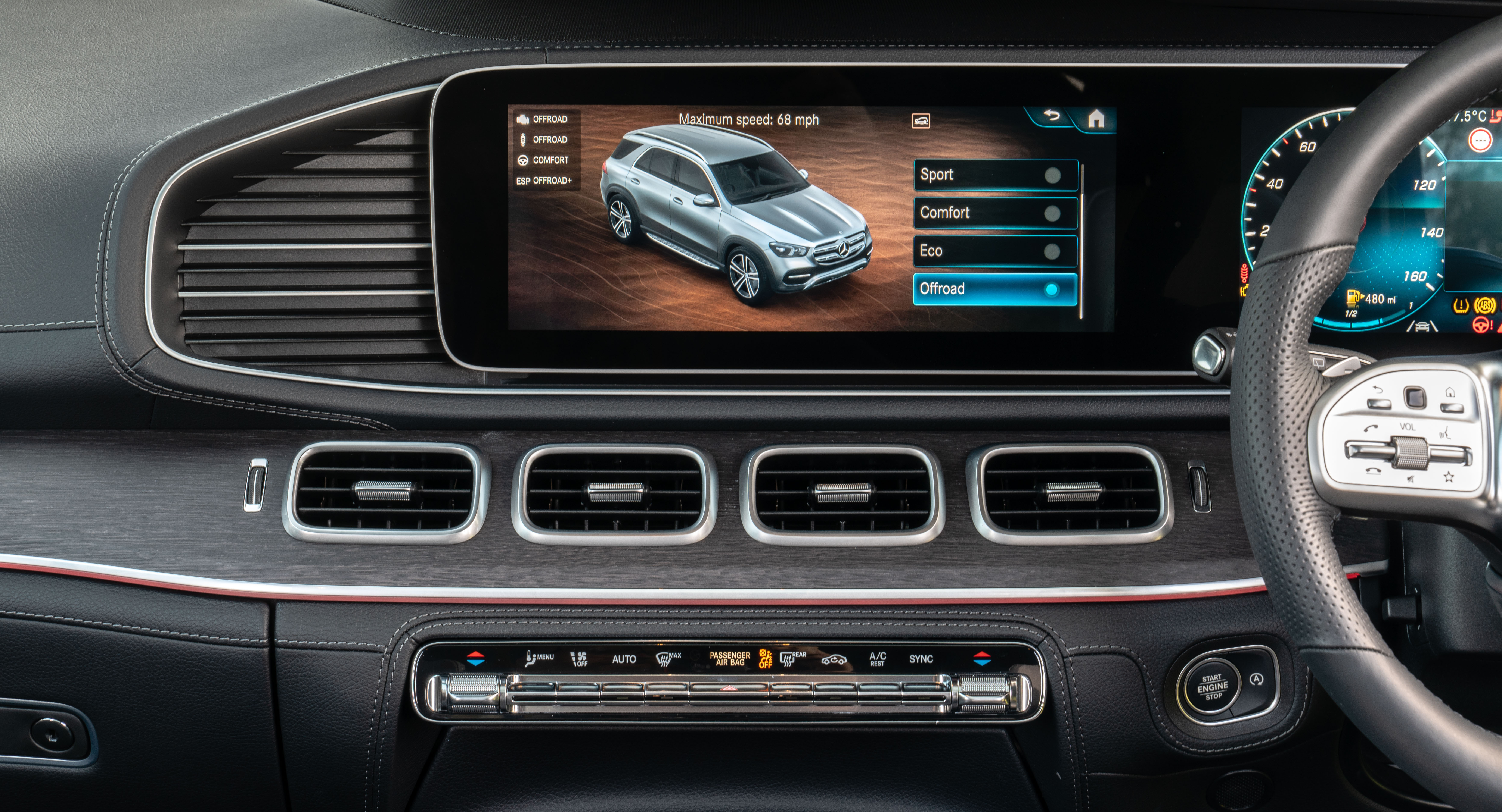 A wide central screen displays key information