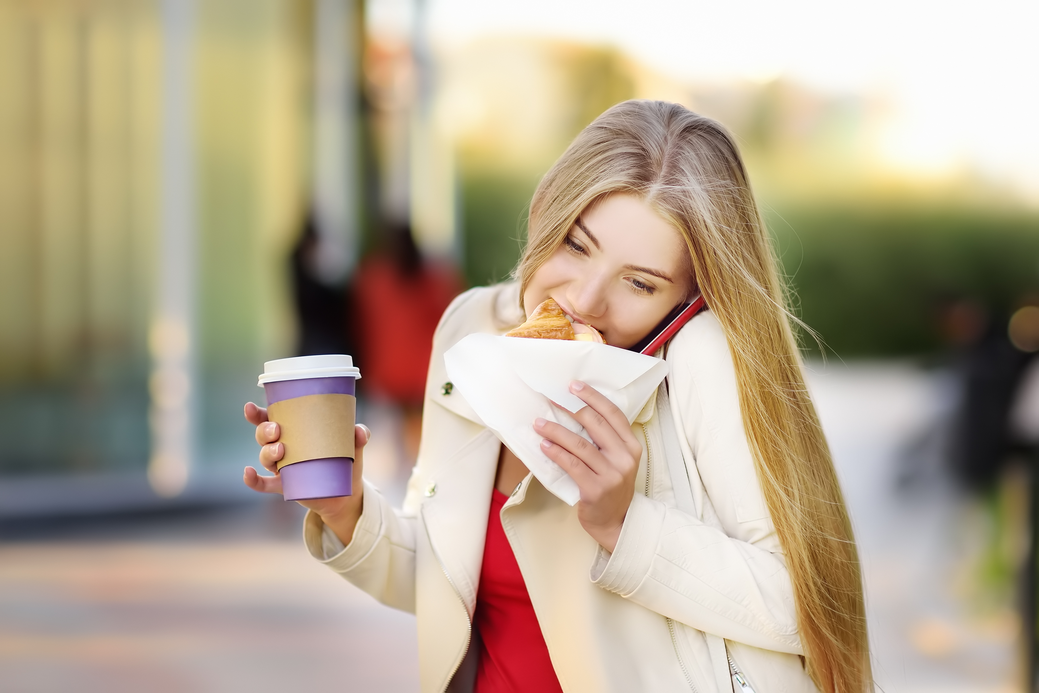 Portrait of young busy woman in the big city