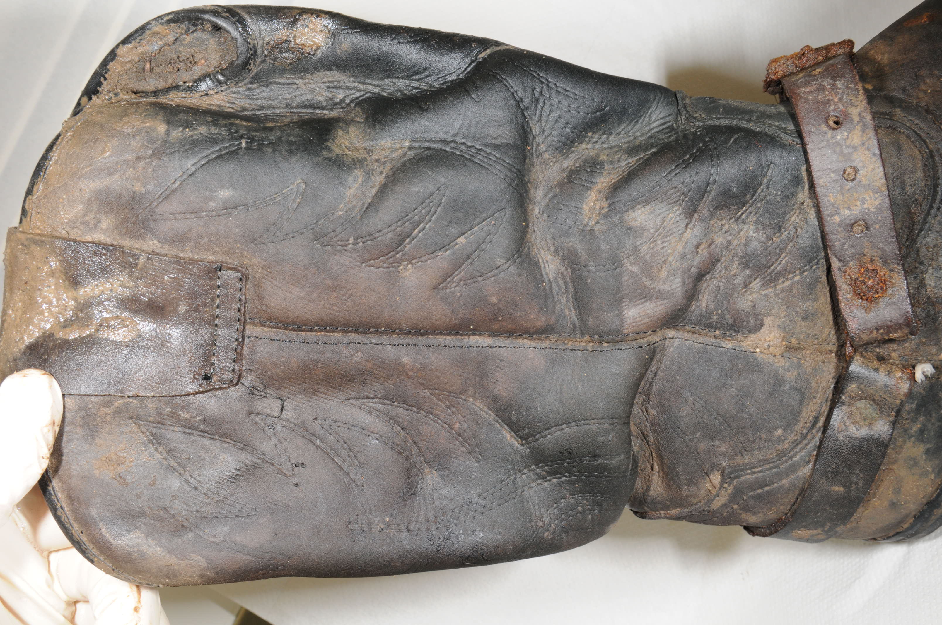 Essex Police has issued photographs of a 'distinctive pair of leather cowboy-style boots' found alongside the skeleton of a man at a scrapyard in St Osyth. (Essex Police/ PA)