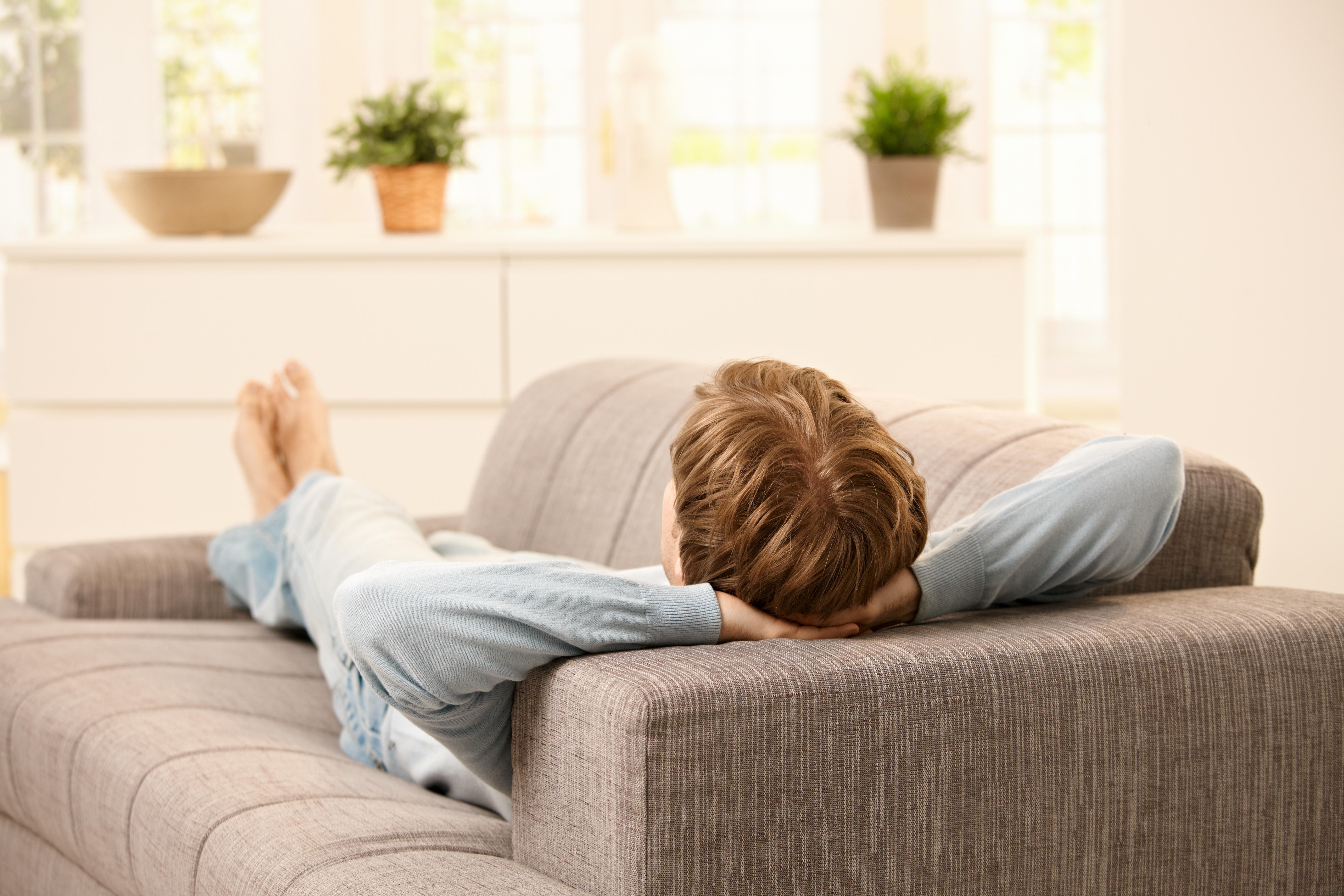 Man lying on sofa