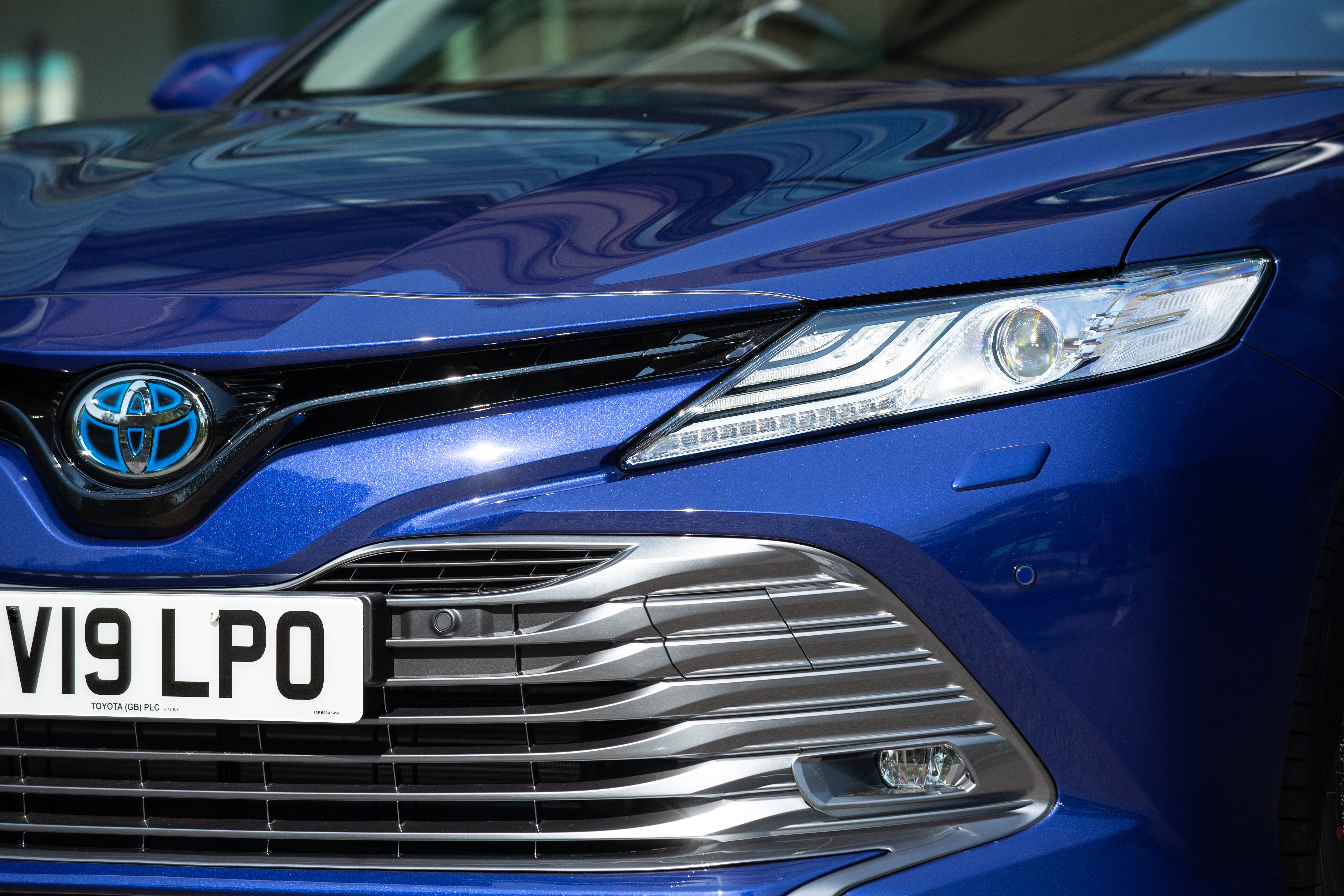 A large grille dominates the front of the car