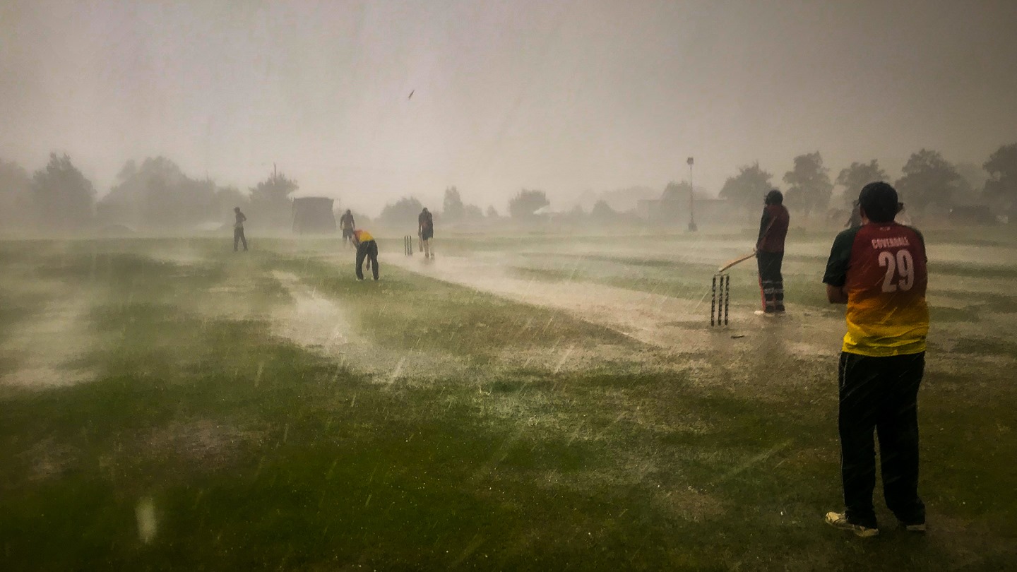 Blunham Cricket Club play through the rain in their world record attempt