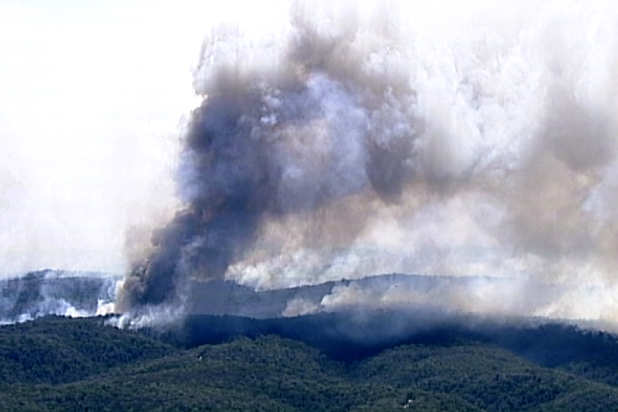 Smoke billows from wildfires in Wollemi, New South Wales