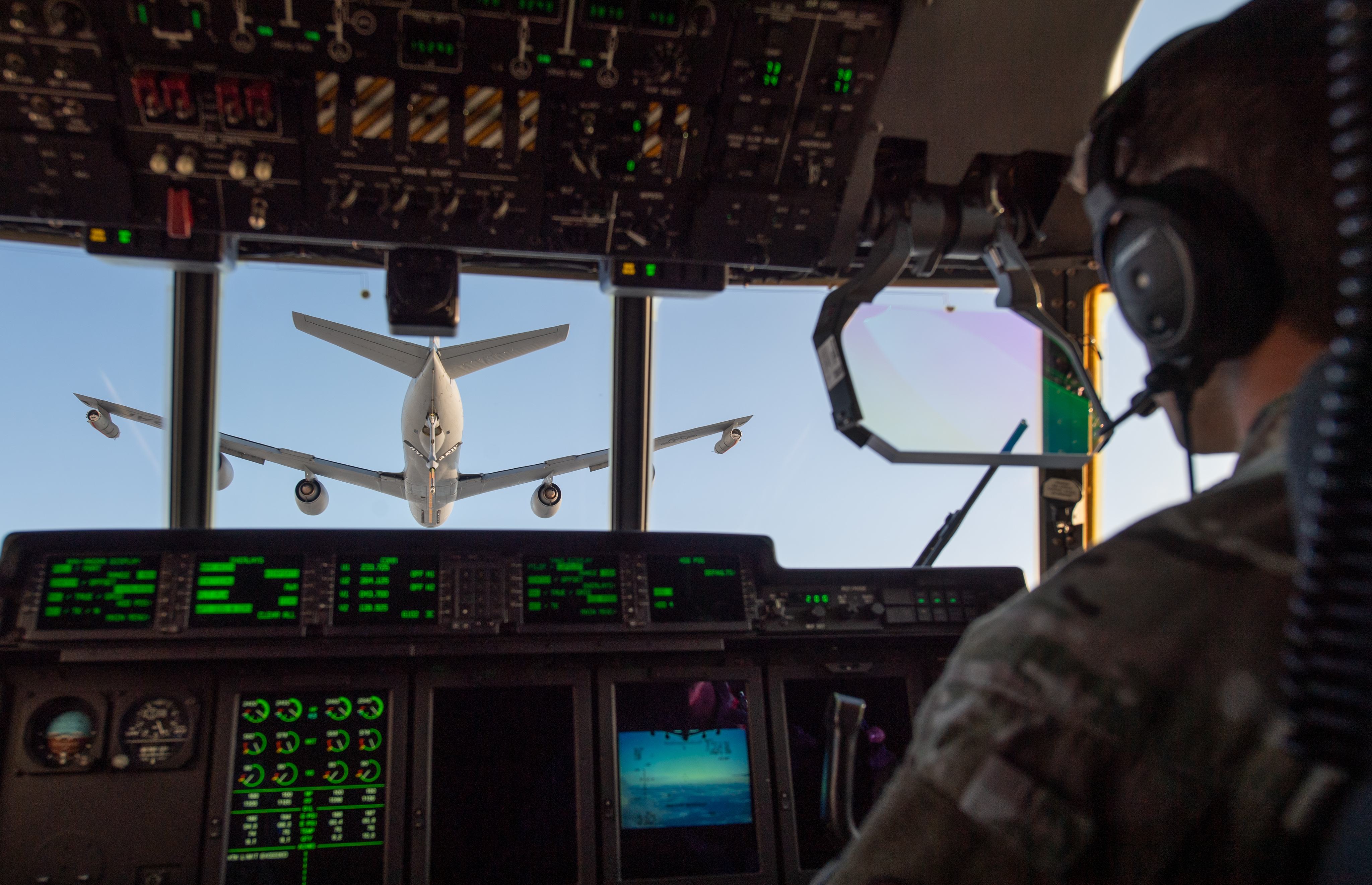 An MC-130J Commando II cargo plane is refuelled by a KC-135 Stratotanker refueller plane. (Joe Giddens/ PA)
