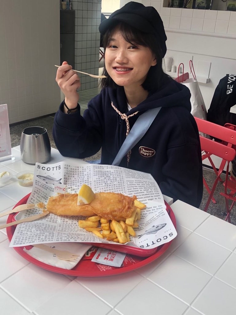A customer enjoys fish and chips at Scotts in Chengdu