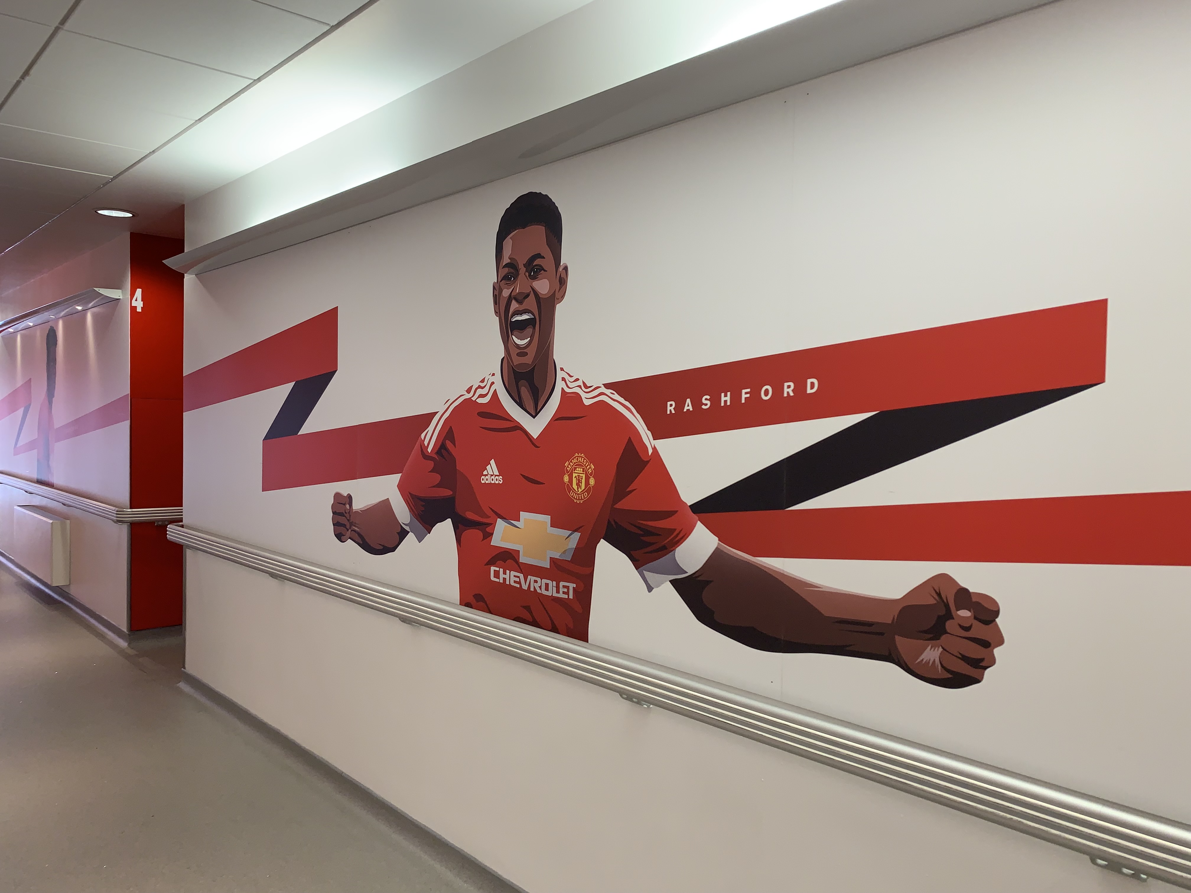 Image of Marcus Rashford on the wall at the Aon Training Complex