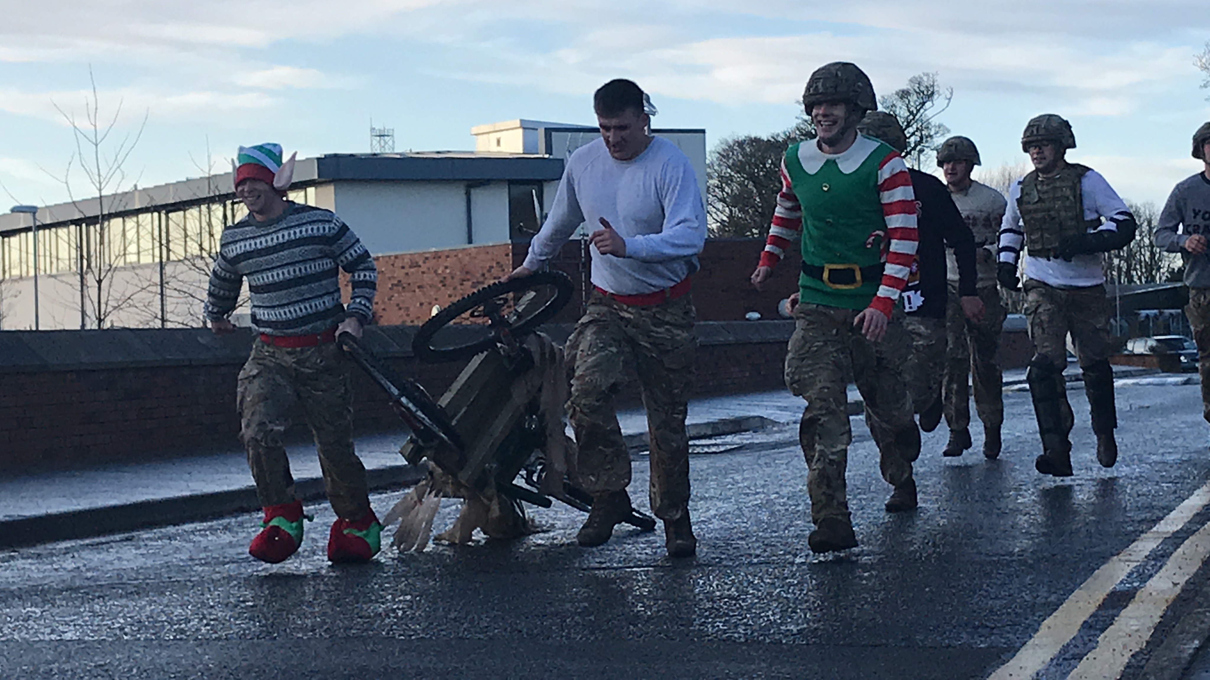 Soldiers of 2 Rifles enjoy improvised sleigh races at Thiepval Barracks in Co Antrim