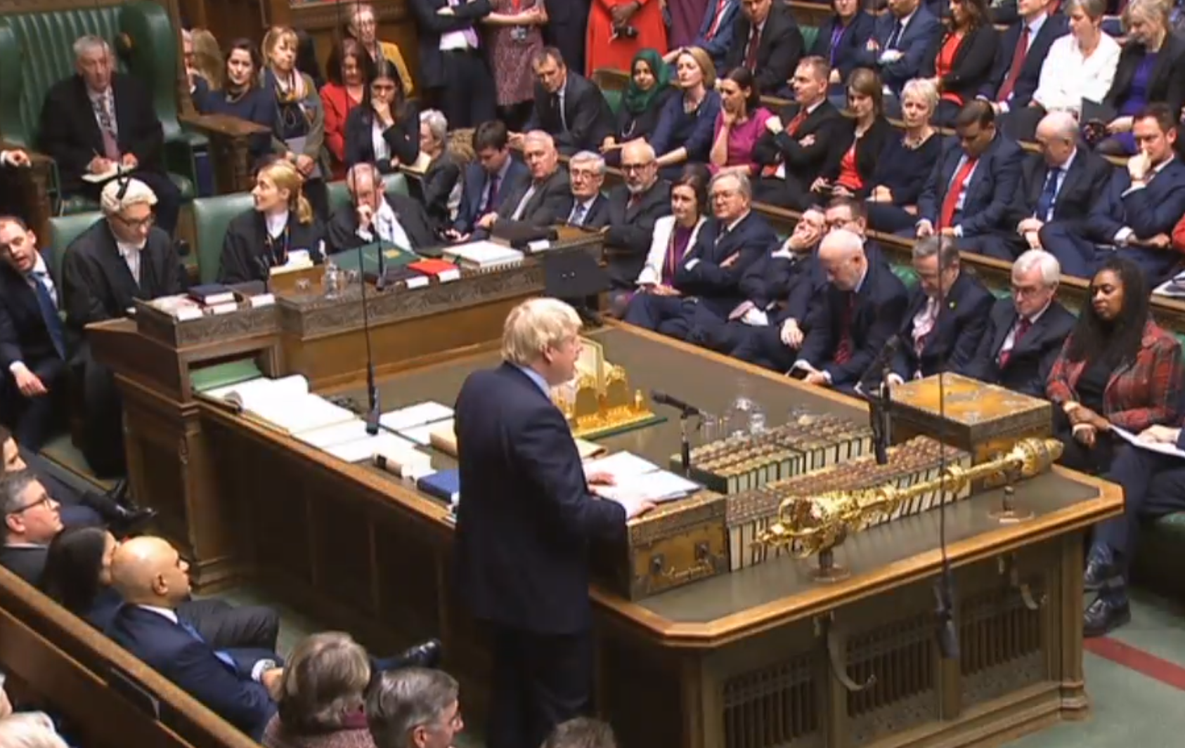 MPs listen as Prime Minister Boris Johnson addresses the Commons 
