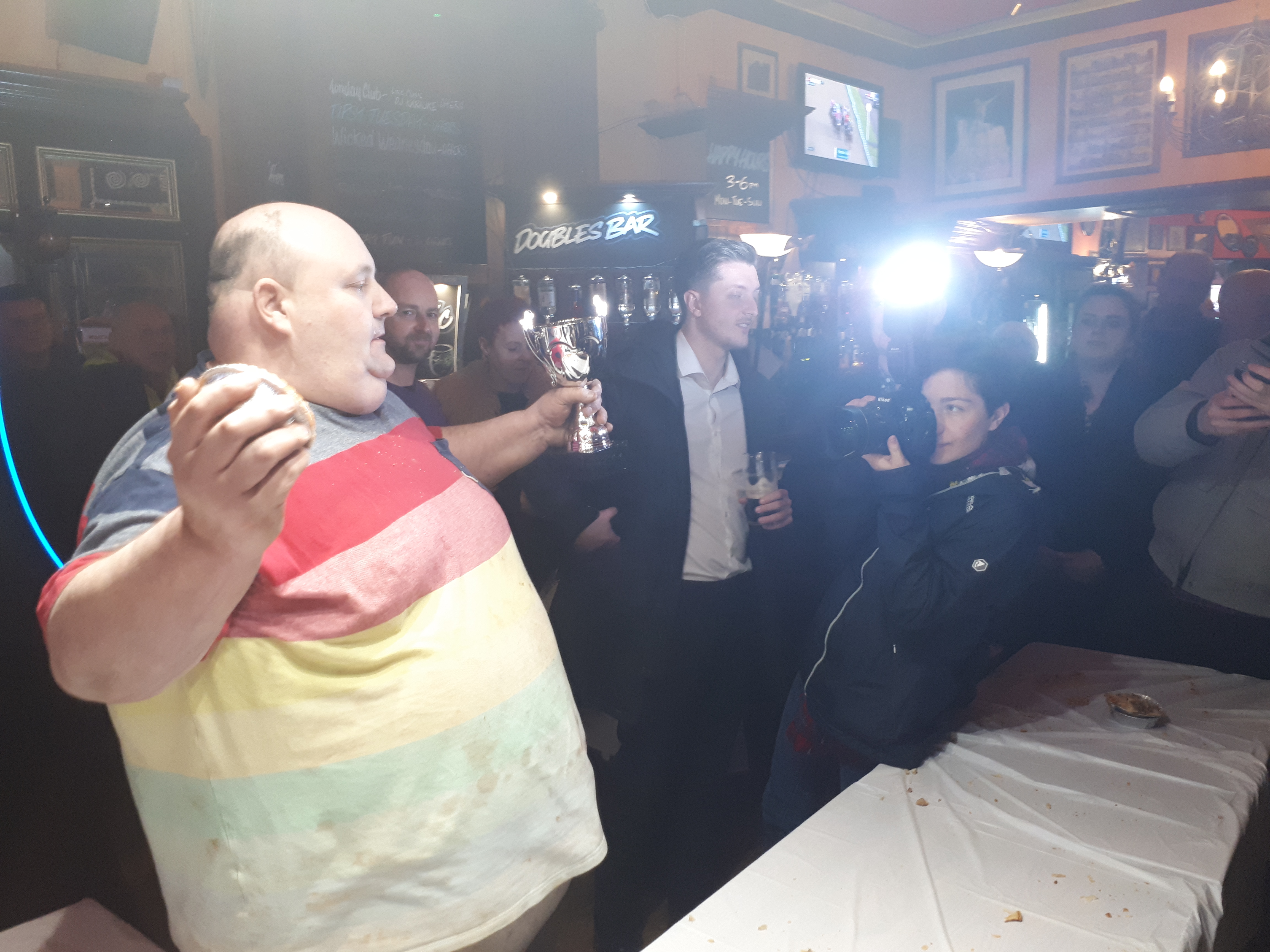 Ian Gerrard (left) poses with the trophy at the 2019 World Pie Eating Championships