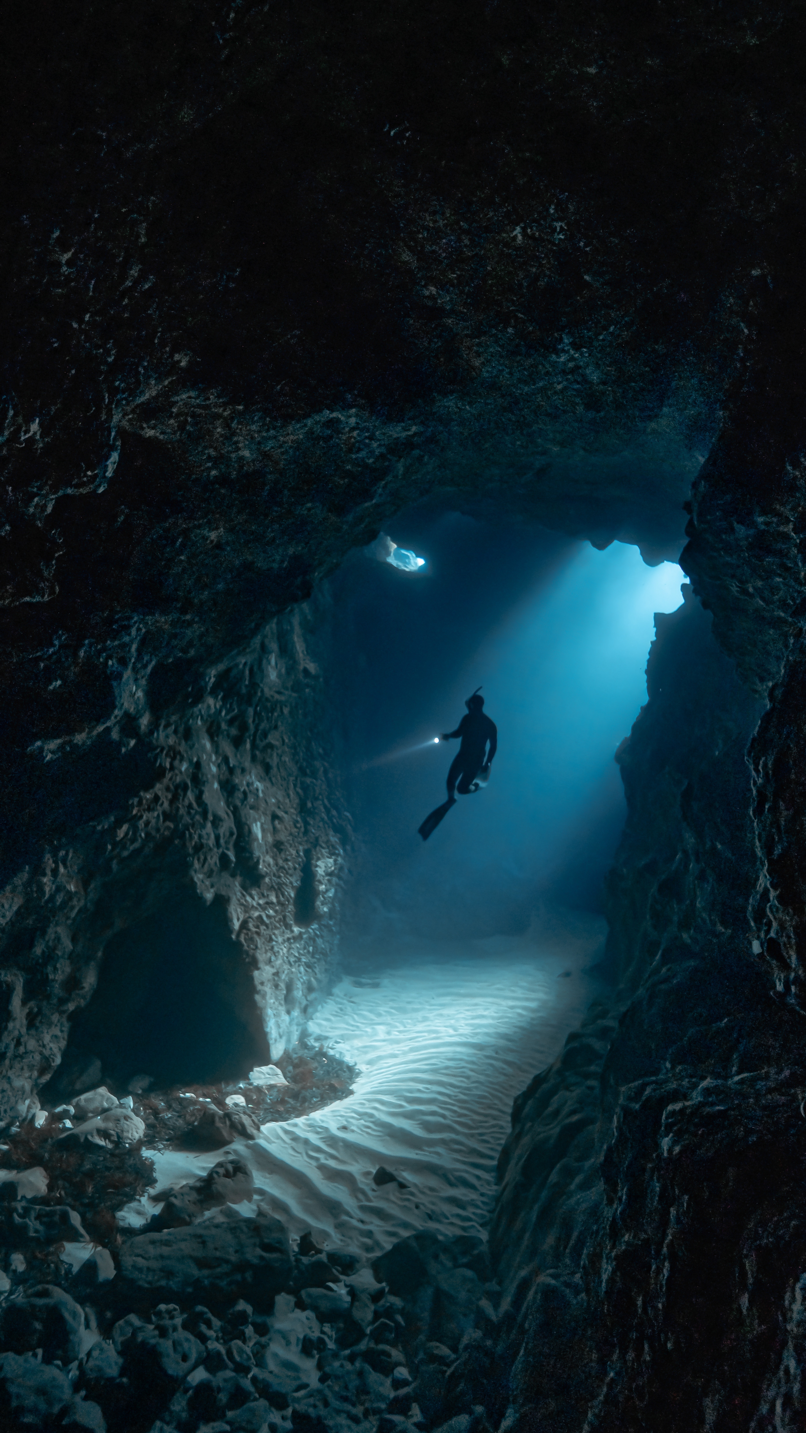 A free diver in an underwater cave network